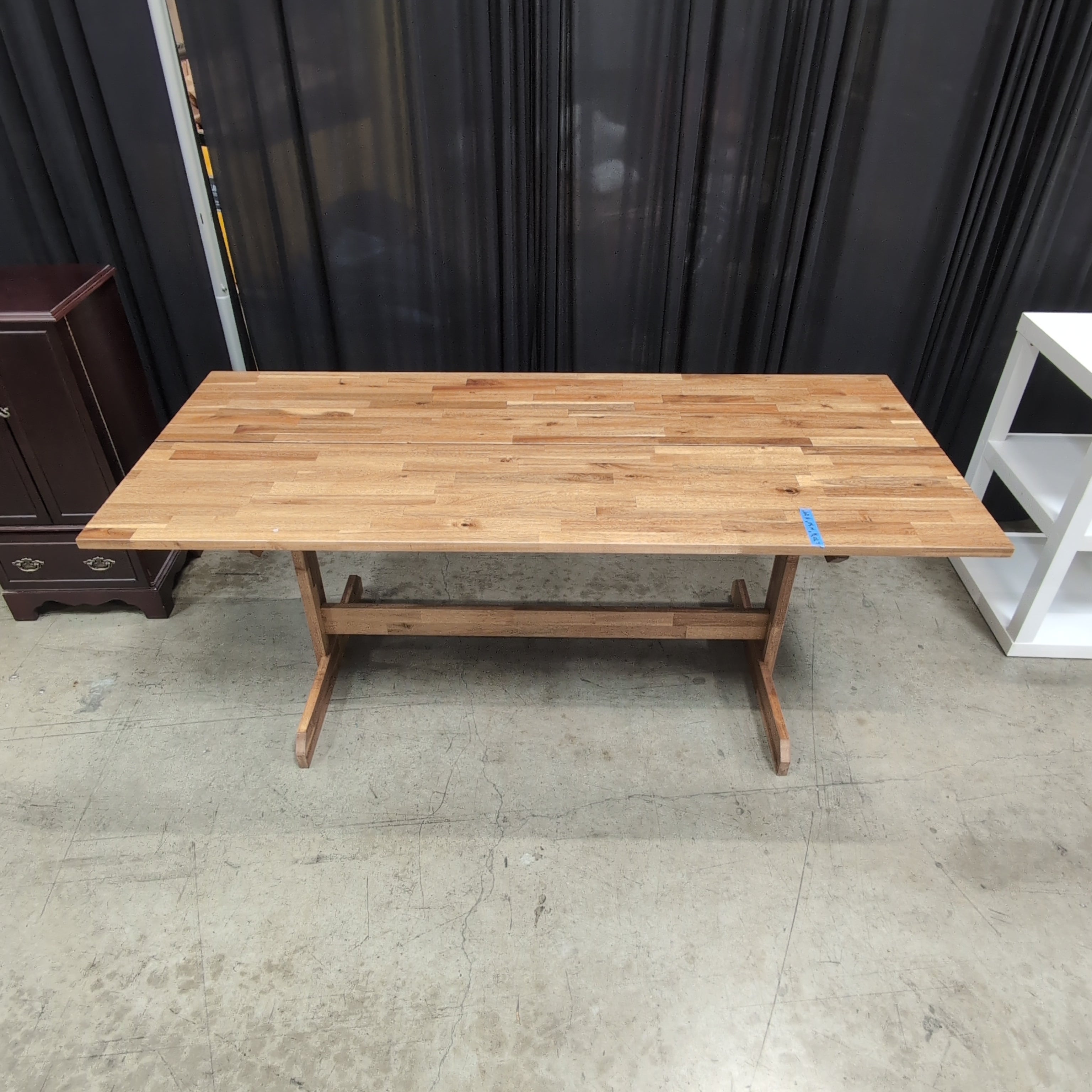 Warm Brown Wood Dining Table with Trestle Base