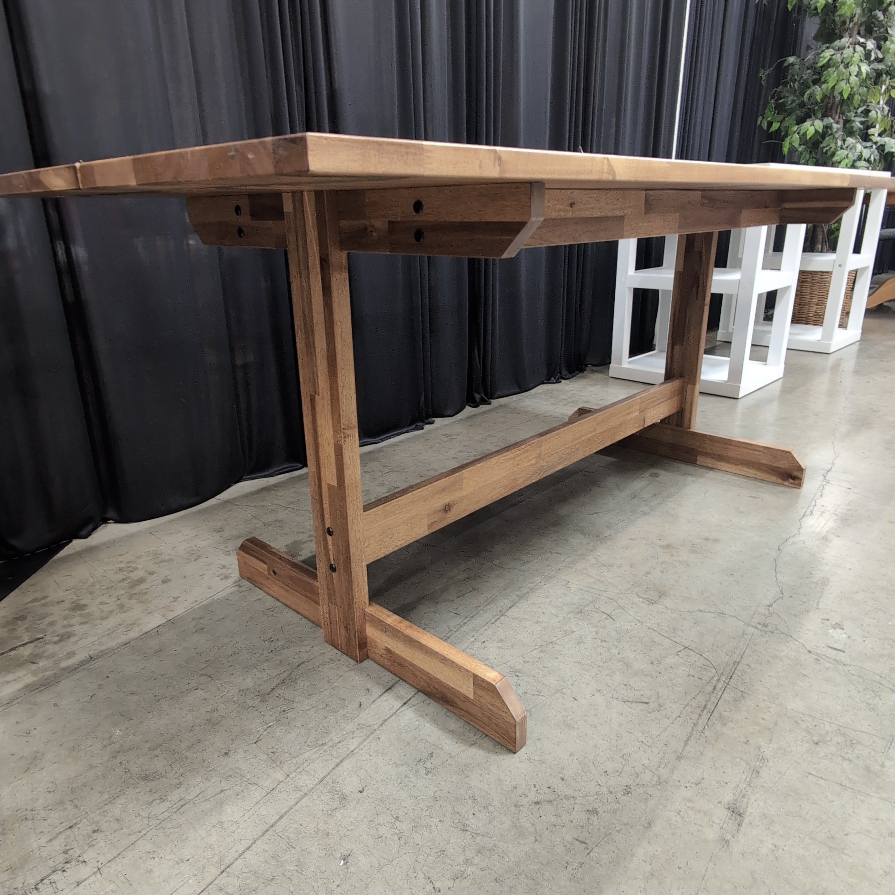Warm Brown Wood Dining Table with Trestle Base