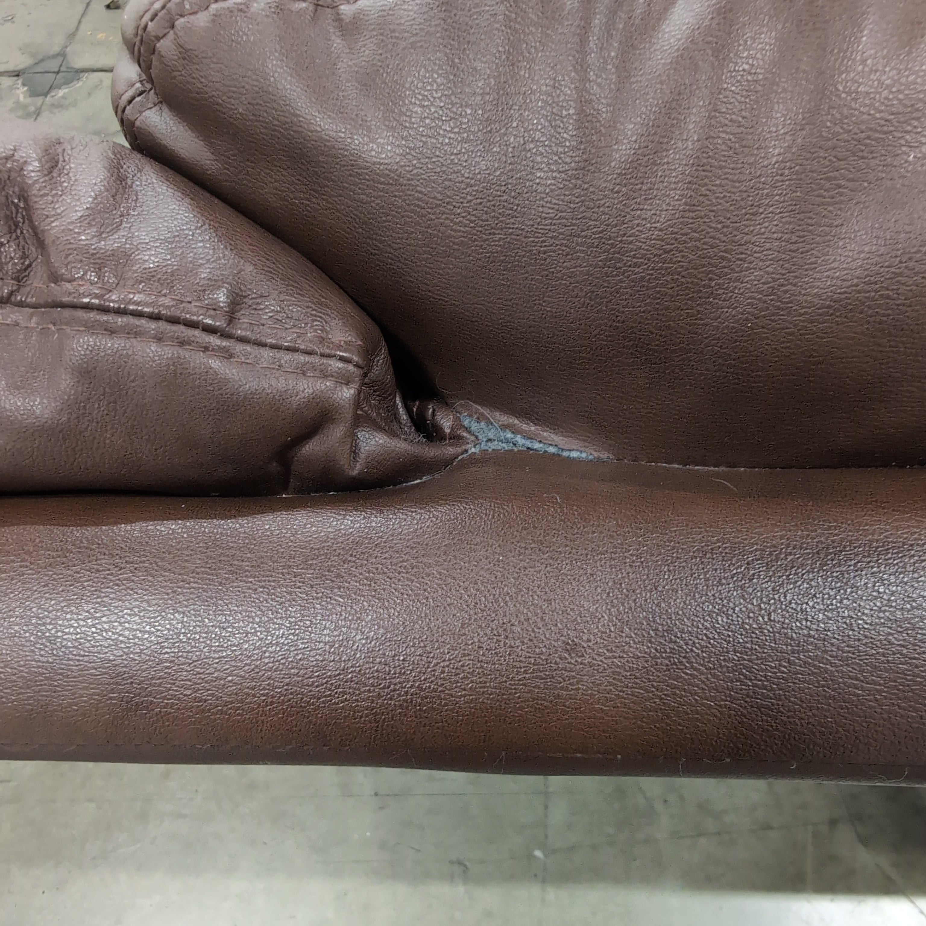Brown Leather Three-Seat Recliner Couch