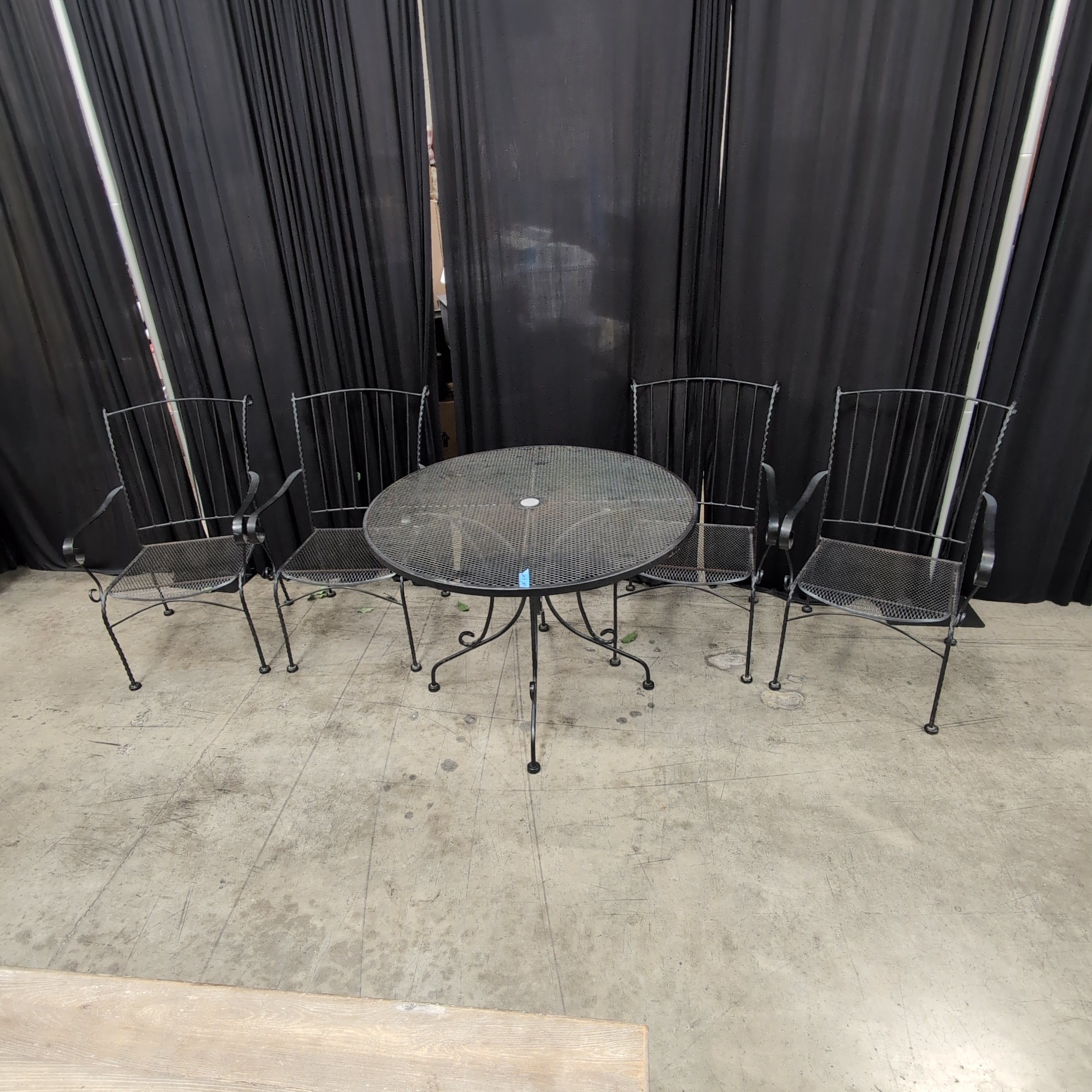 Black Wrought Iron Round Outdoor Table and Four Chairs