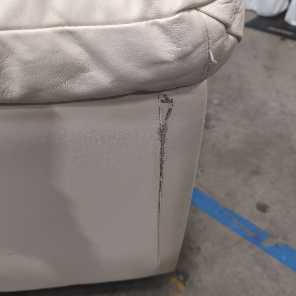 Cream-Colored Three-Seat Padded Couch