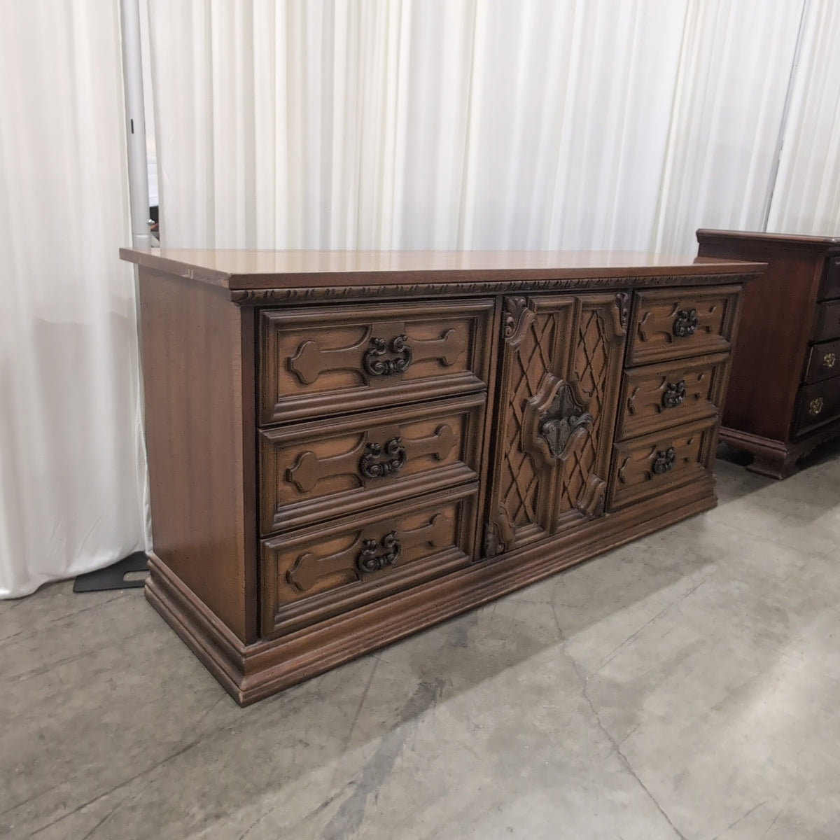 Traditional Brown Wood Dresser with Ornate Hardware