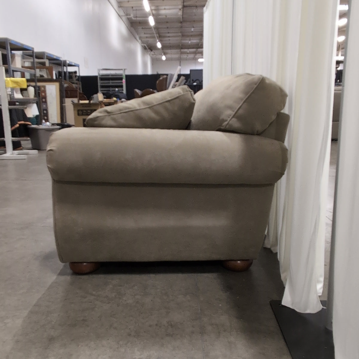 Beige Upholstered Three-Seat Couch with Rolled Arms