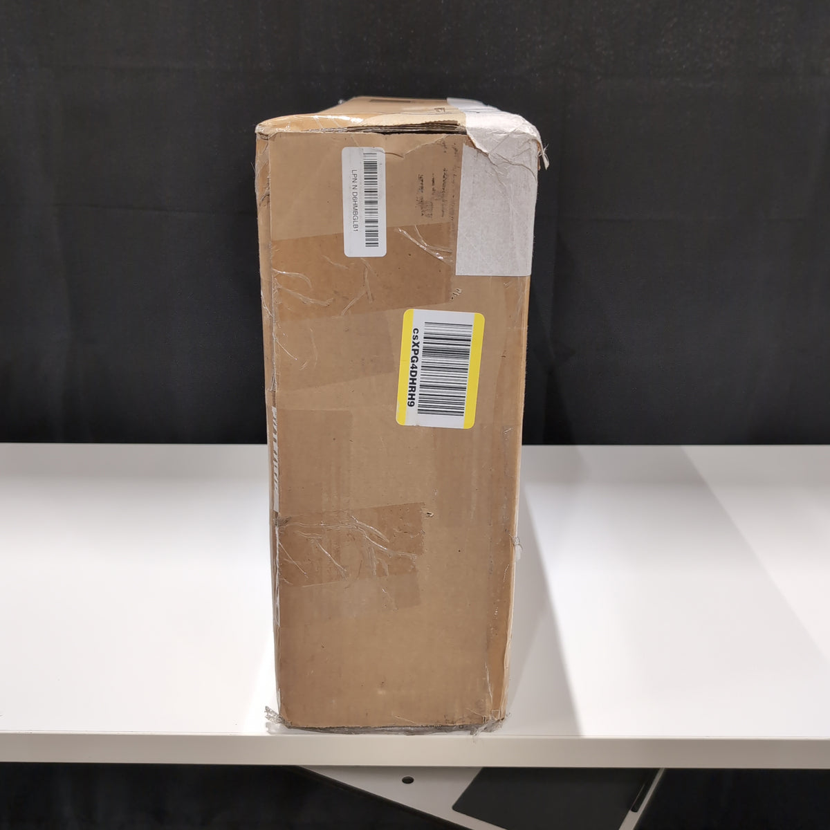 Unknown Item in Sealed Cardboard Box