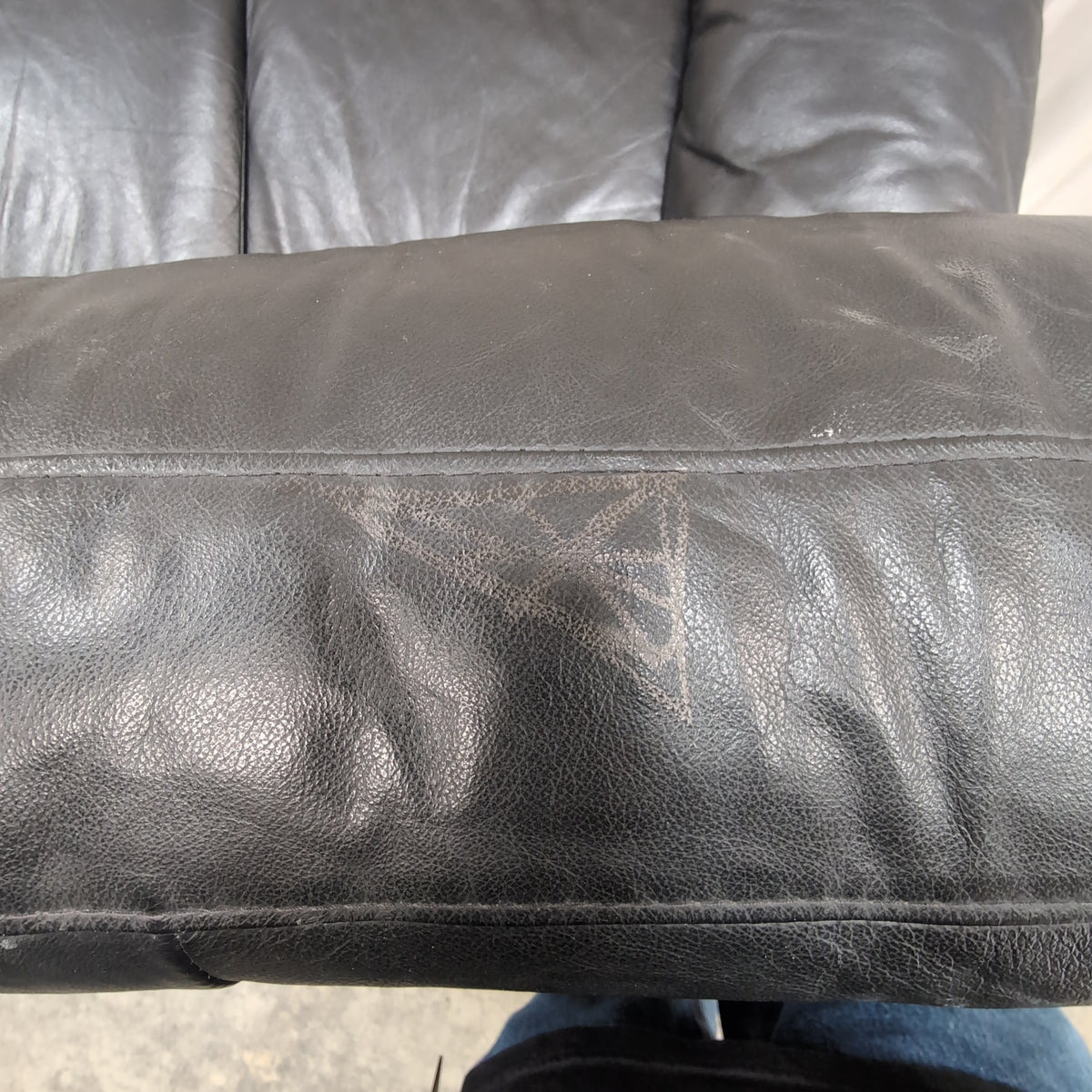 Black Leather Three-Seat Couch with Padded Arms