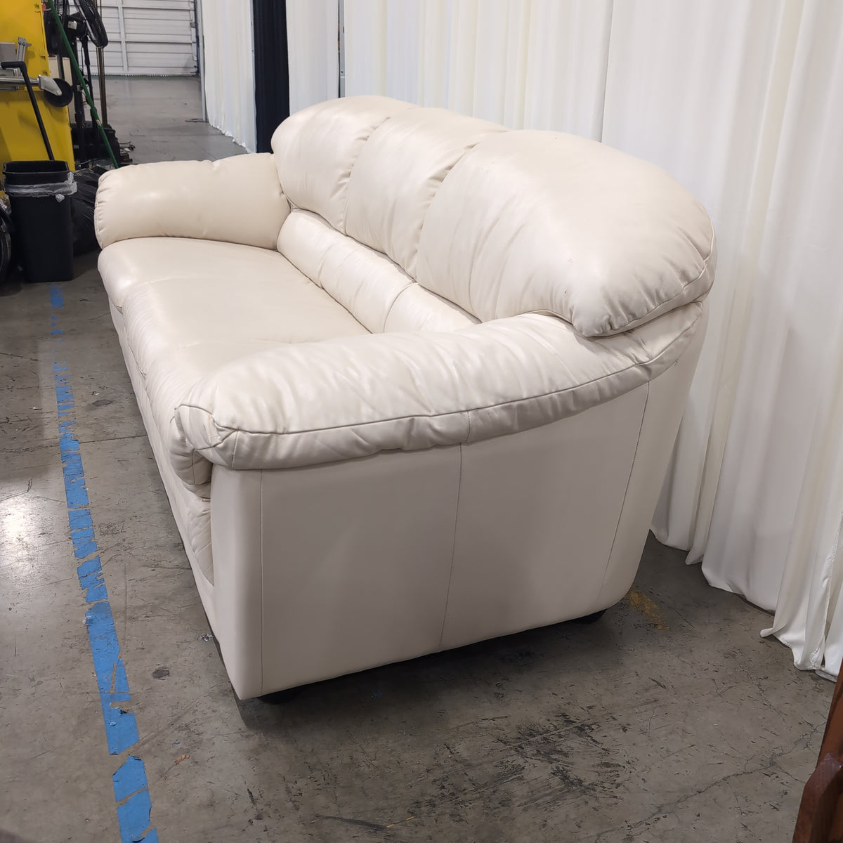 Cream-Colored Three-Seat Padded Couch
