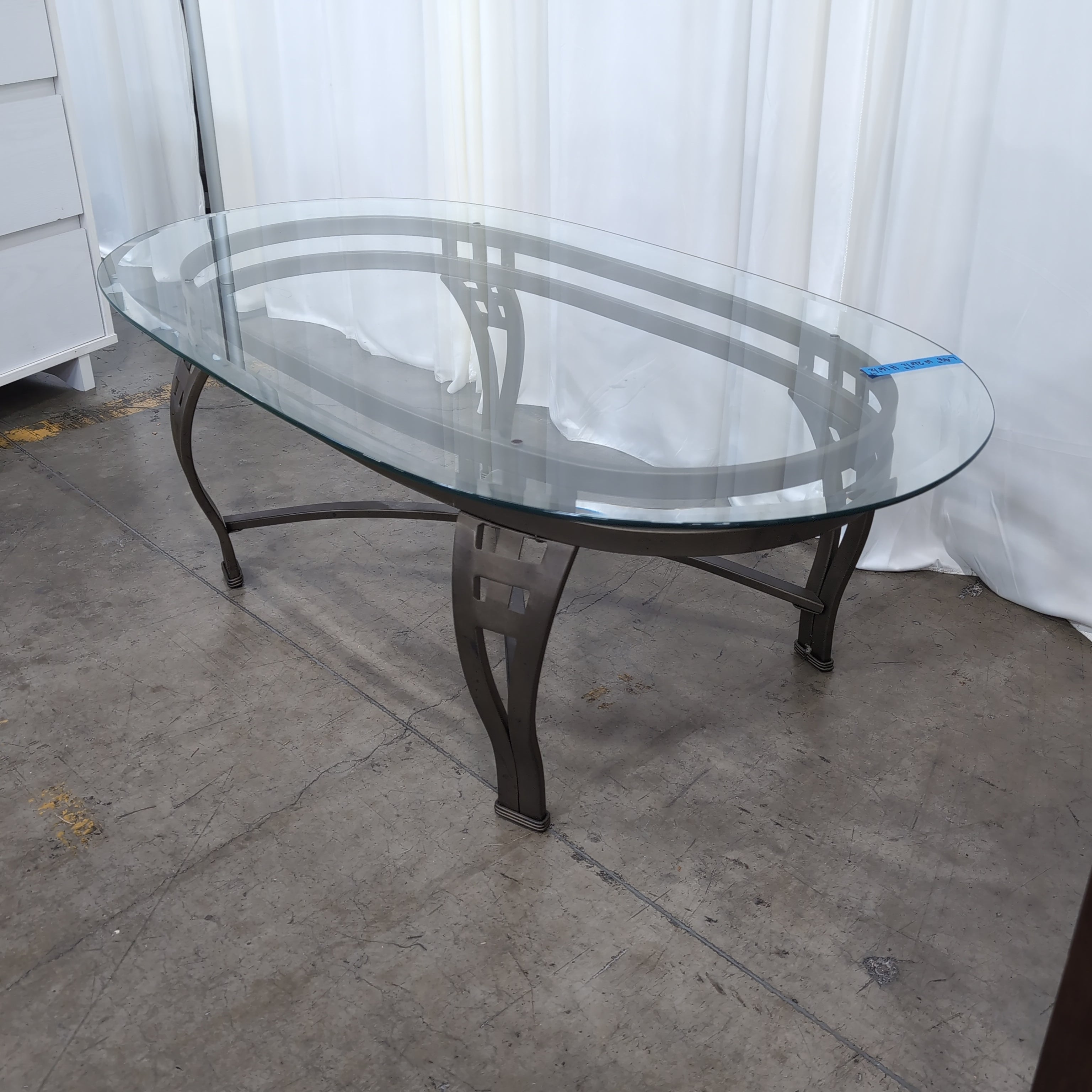 Oval Glass Coffee Table with Dark Metal Base