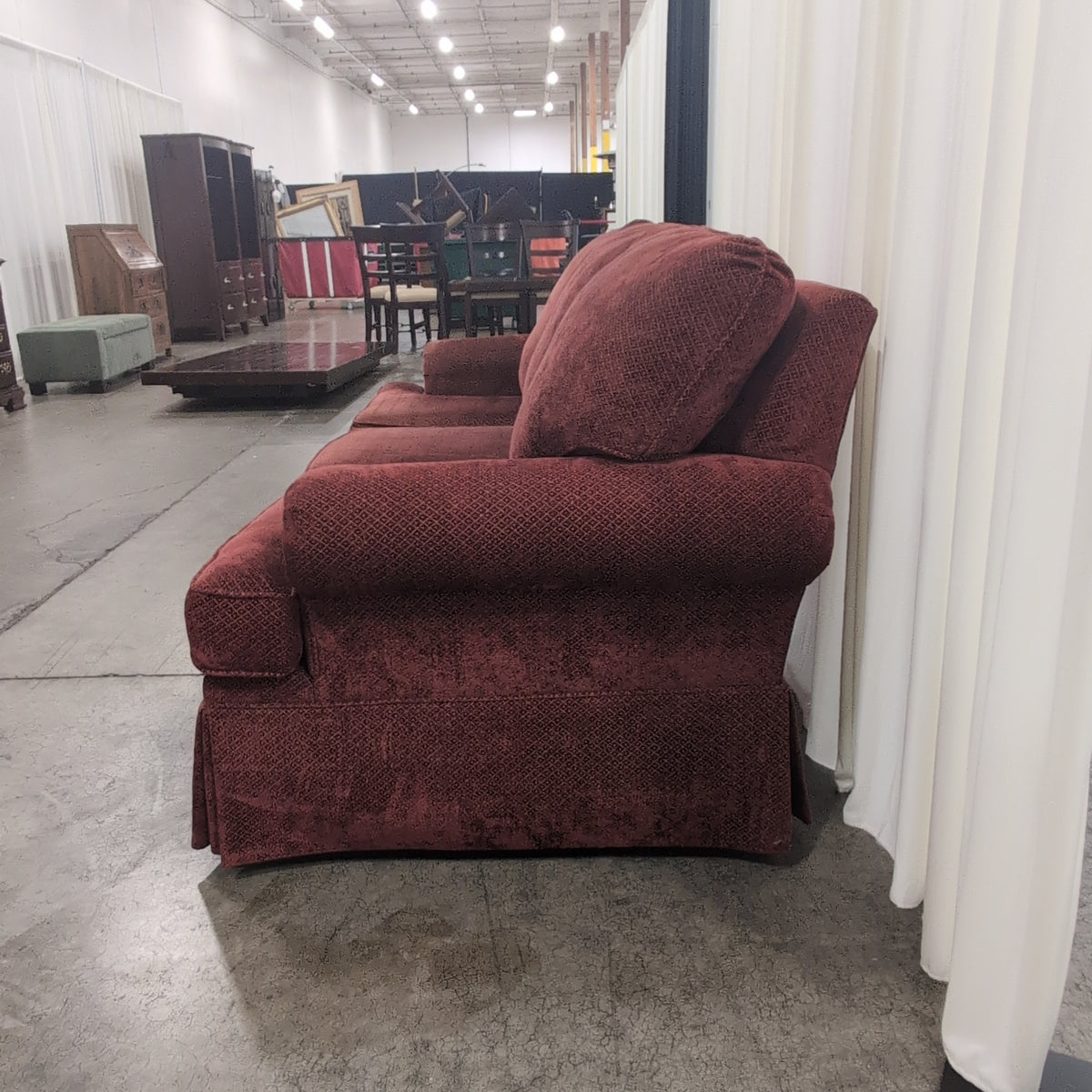 Deep Red Upholstered Three-Seat Couch