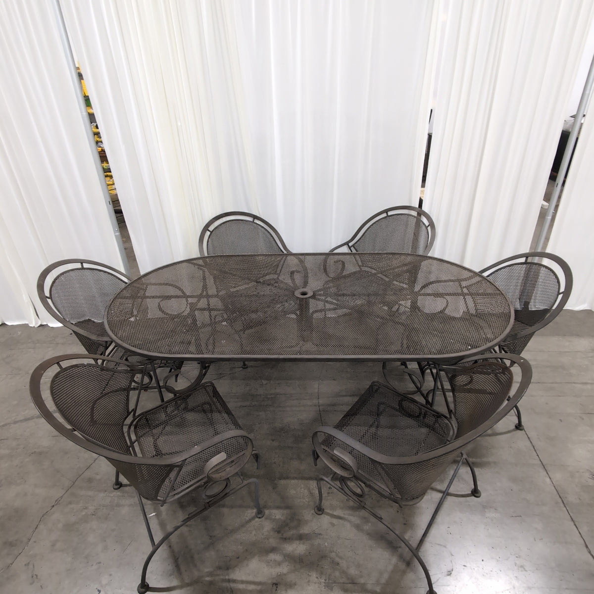 Dark Metal Oval Outdoor Table with Umbrella Hole