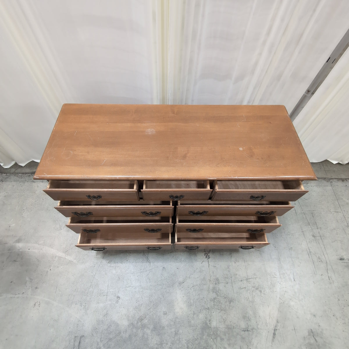 Traditional Honey Tone Nine-Drawer Dresser with Ornate Hardware
