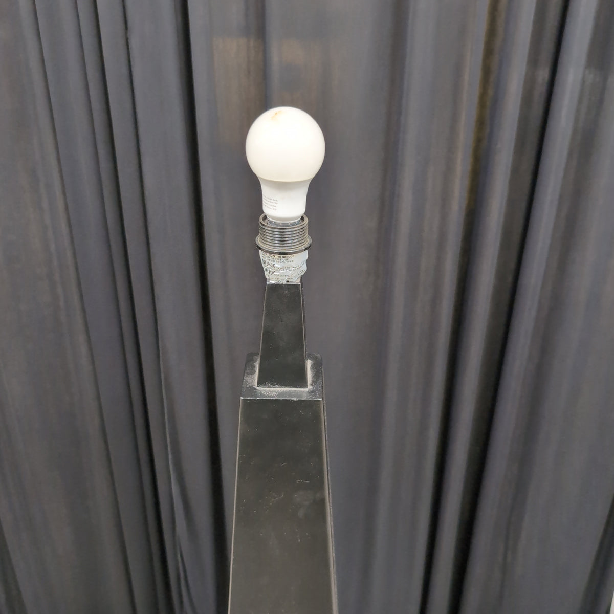 Tall Black Tapered Floor Lamp with Exposed Bulb