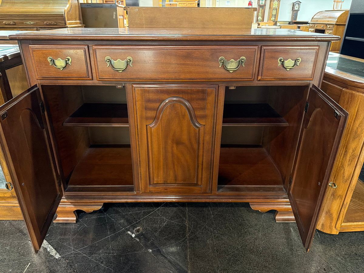 Traditional Cherry-Toned Wood Buffet with Ornate Hardware