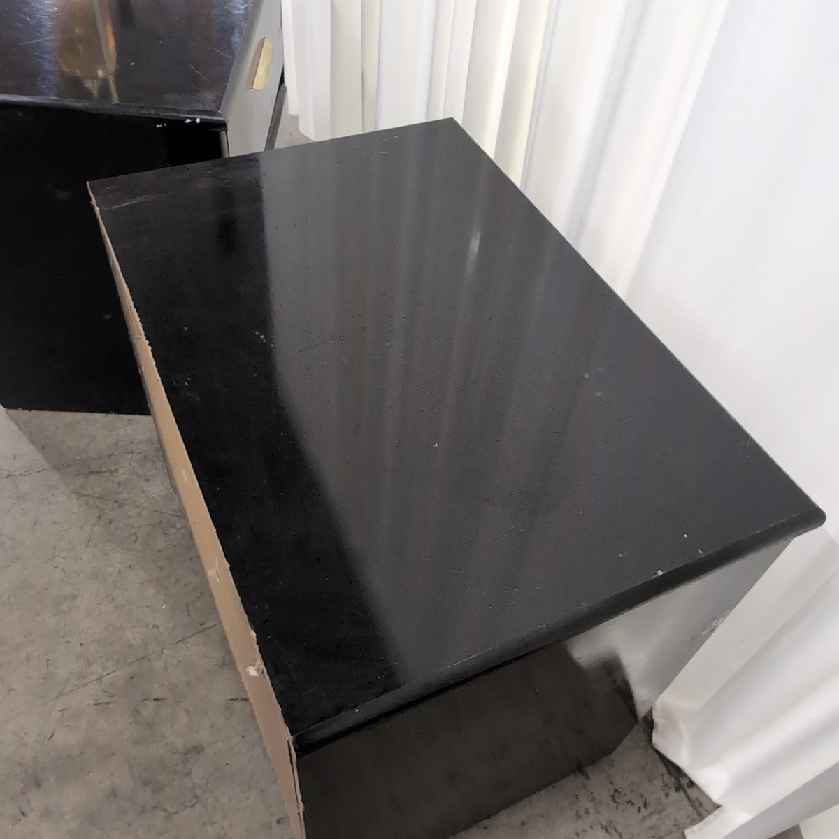 Black Lacquer Four-Drawer Dresser with Gold Pulls