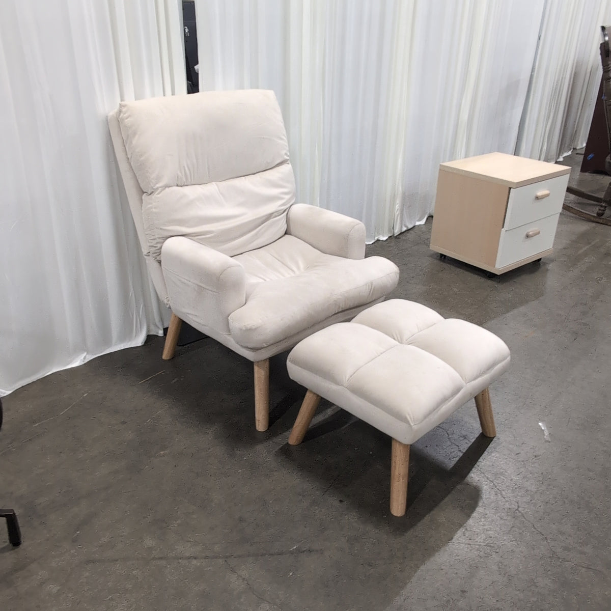 Cream Upholstered Four-Cushion Ottoman with Tapered Legs
