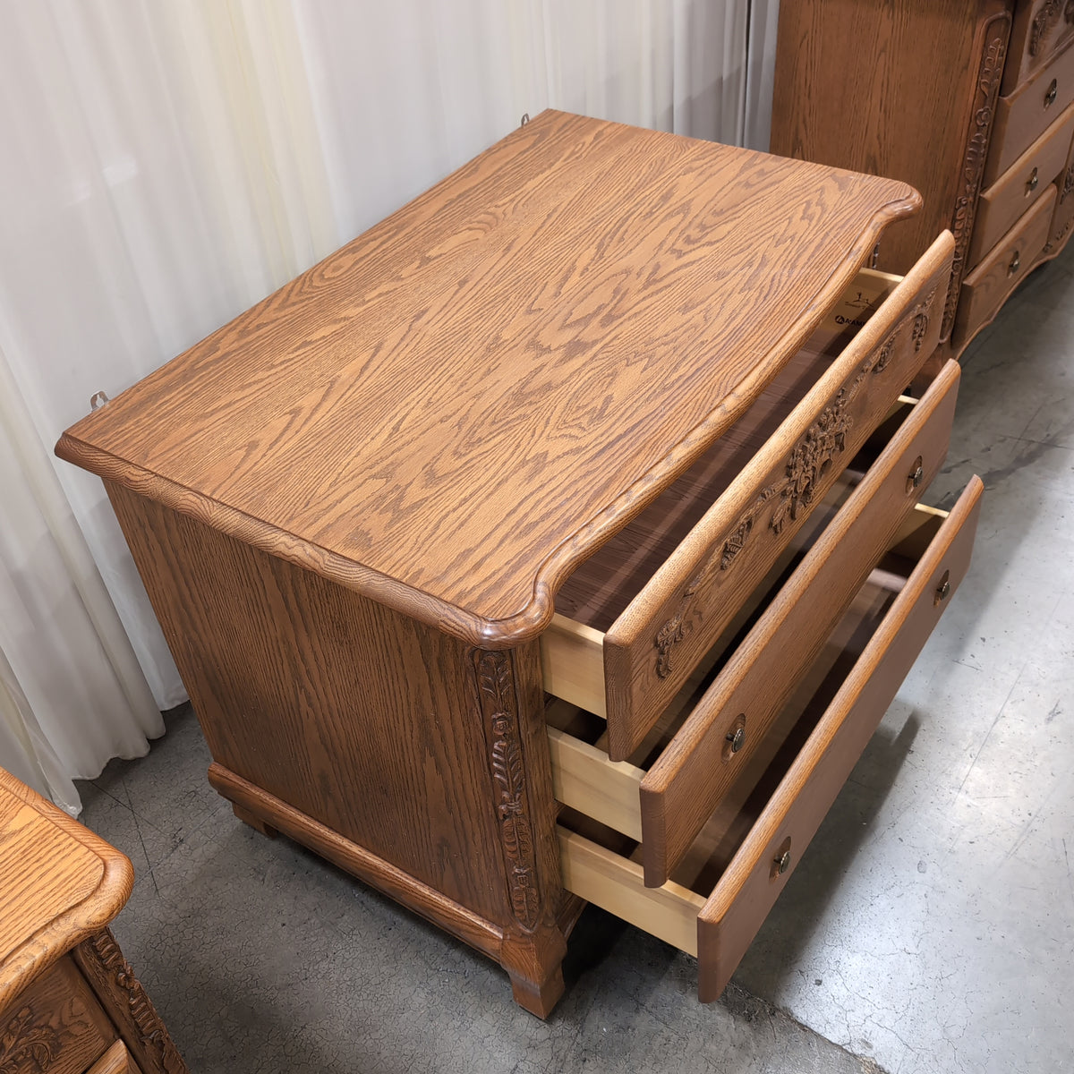 Ornate Carved Wood Three-Drawer Dresser with Floral Motifs