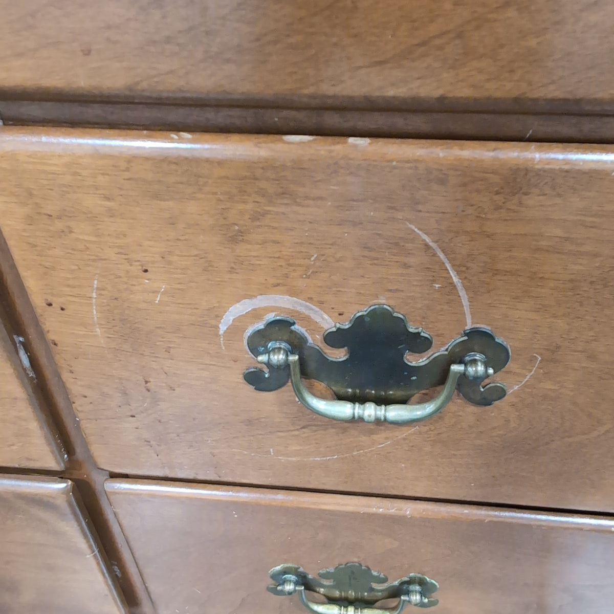 Brown Wood Nine-Drawer Dresser with Ornate Hardware