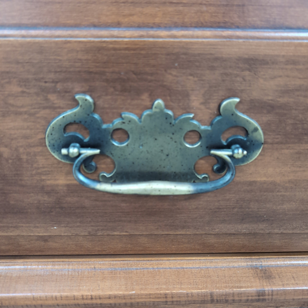 Traditional Brown Wood Dresser with Ornate Hardware