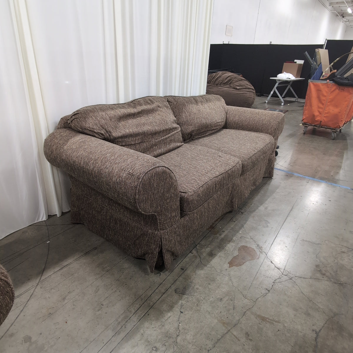 Textured Brown Rolled Arm Couch with Skirted Base