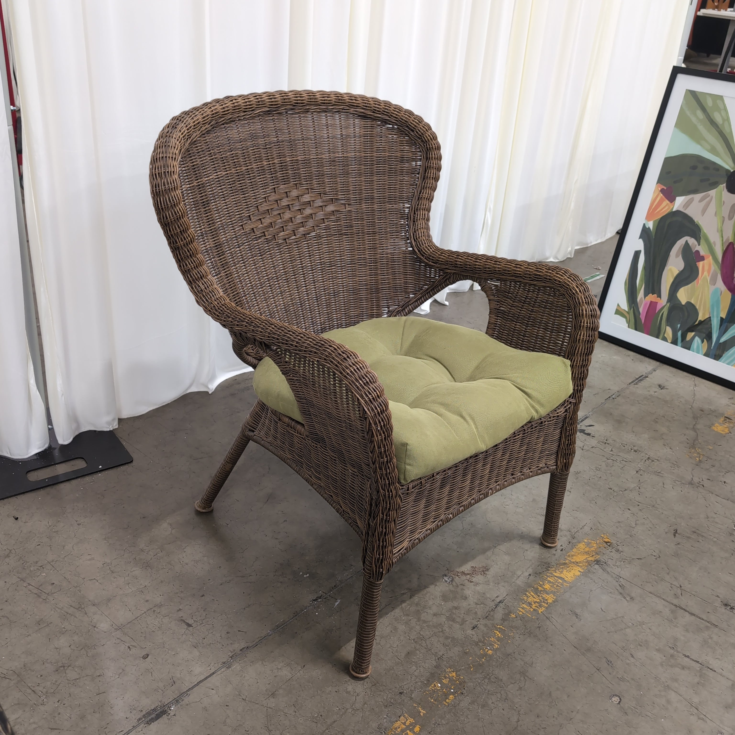 Brown Wicker Accent Chair with Green Cushion