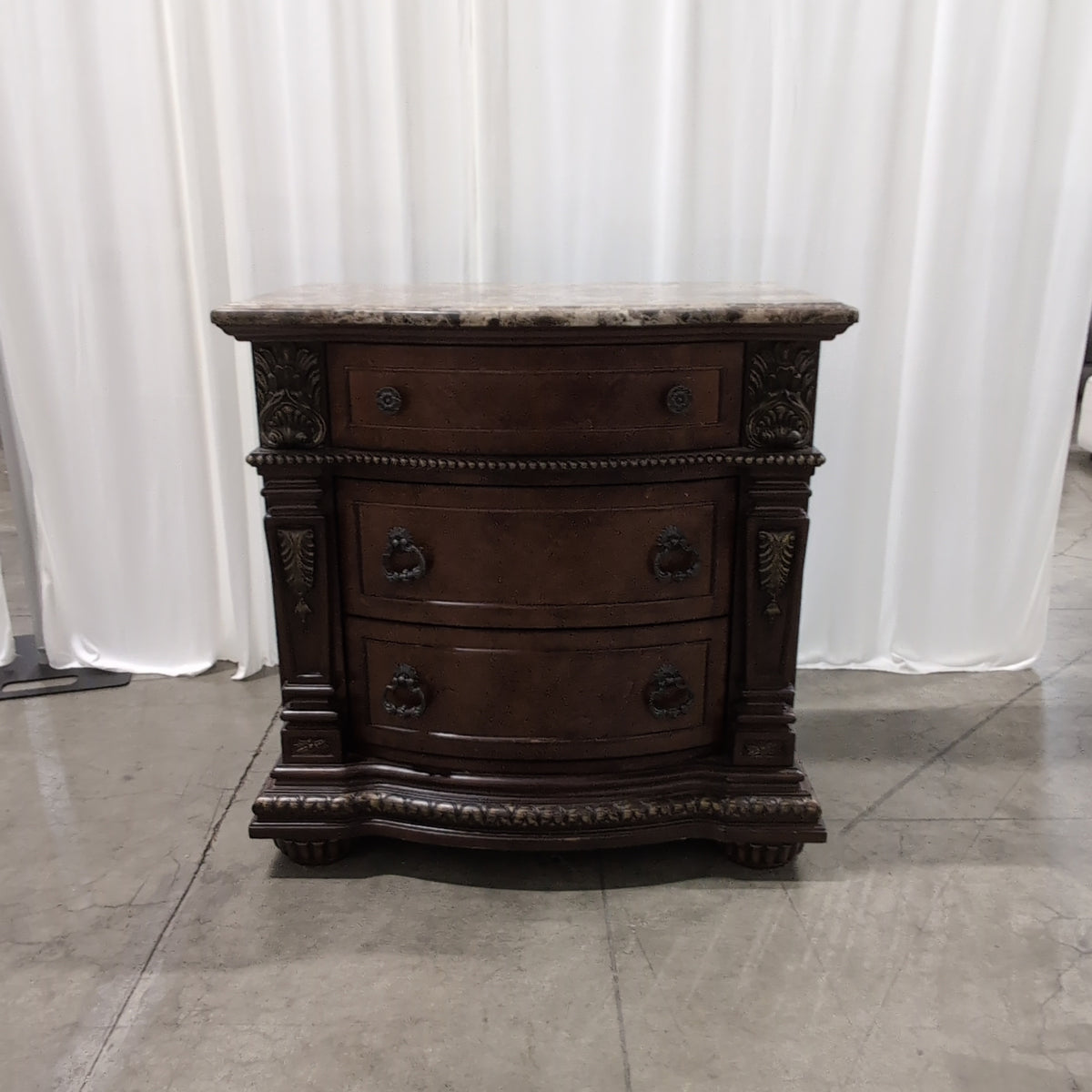 Ornate Dark Wood Three-Drawer Nightstand with Marble Top