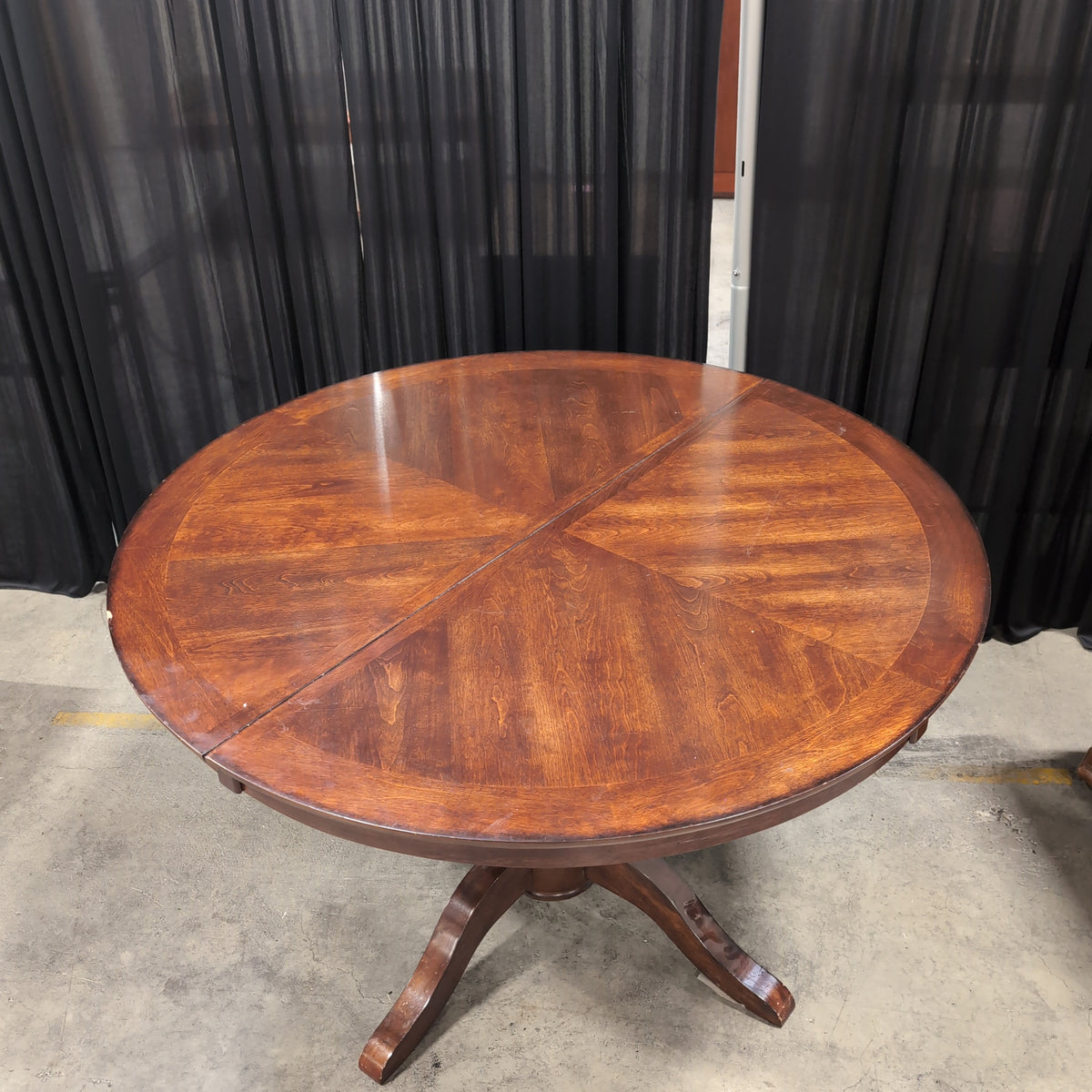 Round Dark Wood Dining Table with Pedestal Base