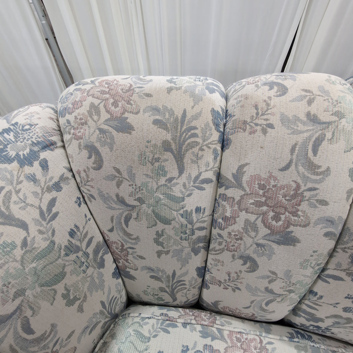 Floral Pattern Skirted Upholstered Couch with Rolled Arms