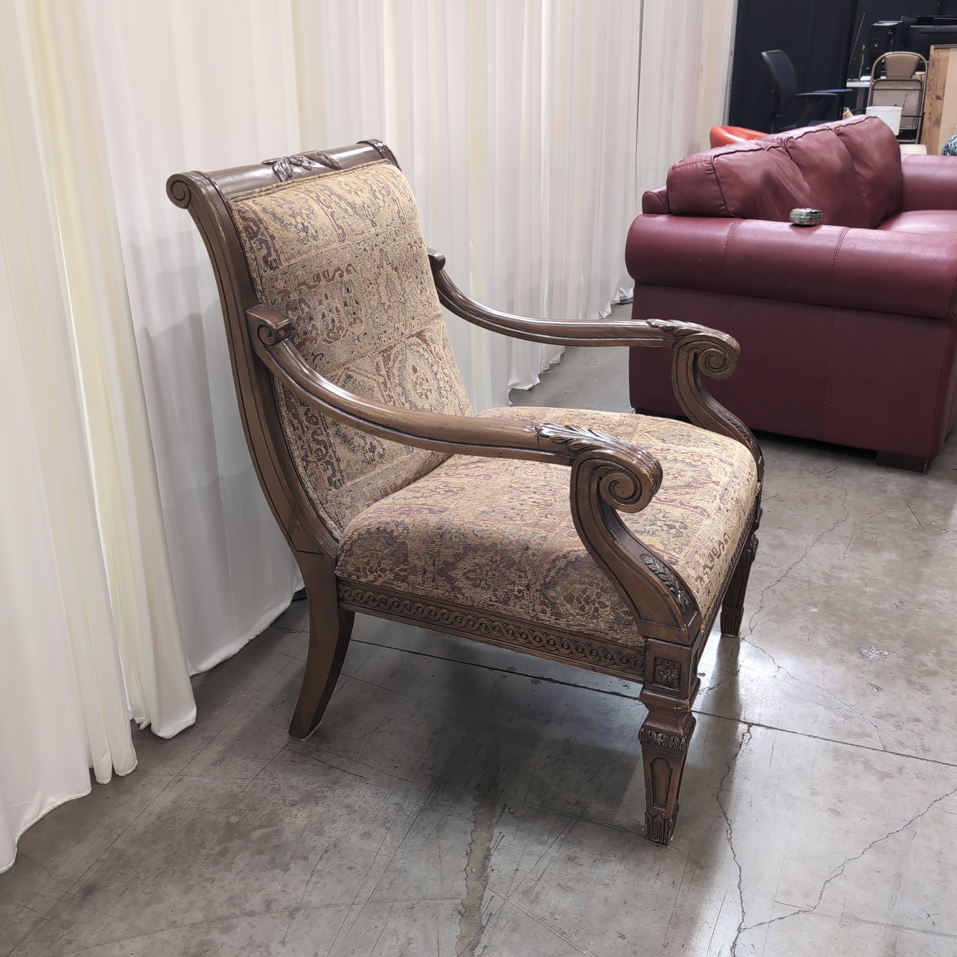Traditional Carved Wood Accent Chair with Patterned Upholstery