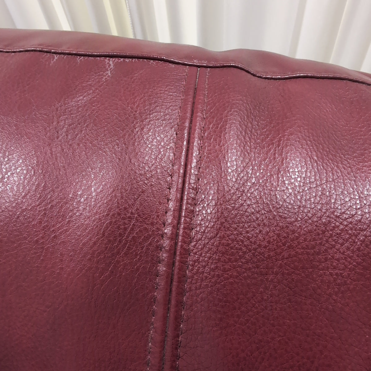 Deep Red Leather Recliner with Padded Headrest