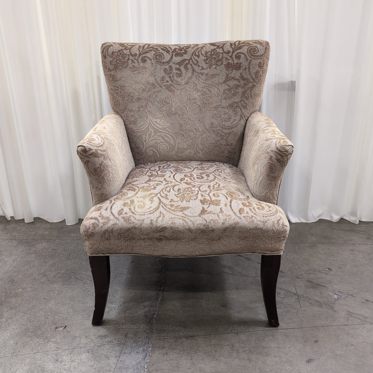 Beige Damask Upholstered Wingback Armchair with Dark Wood Legs