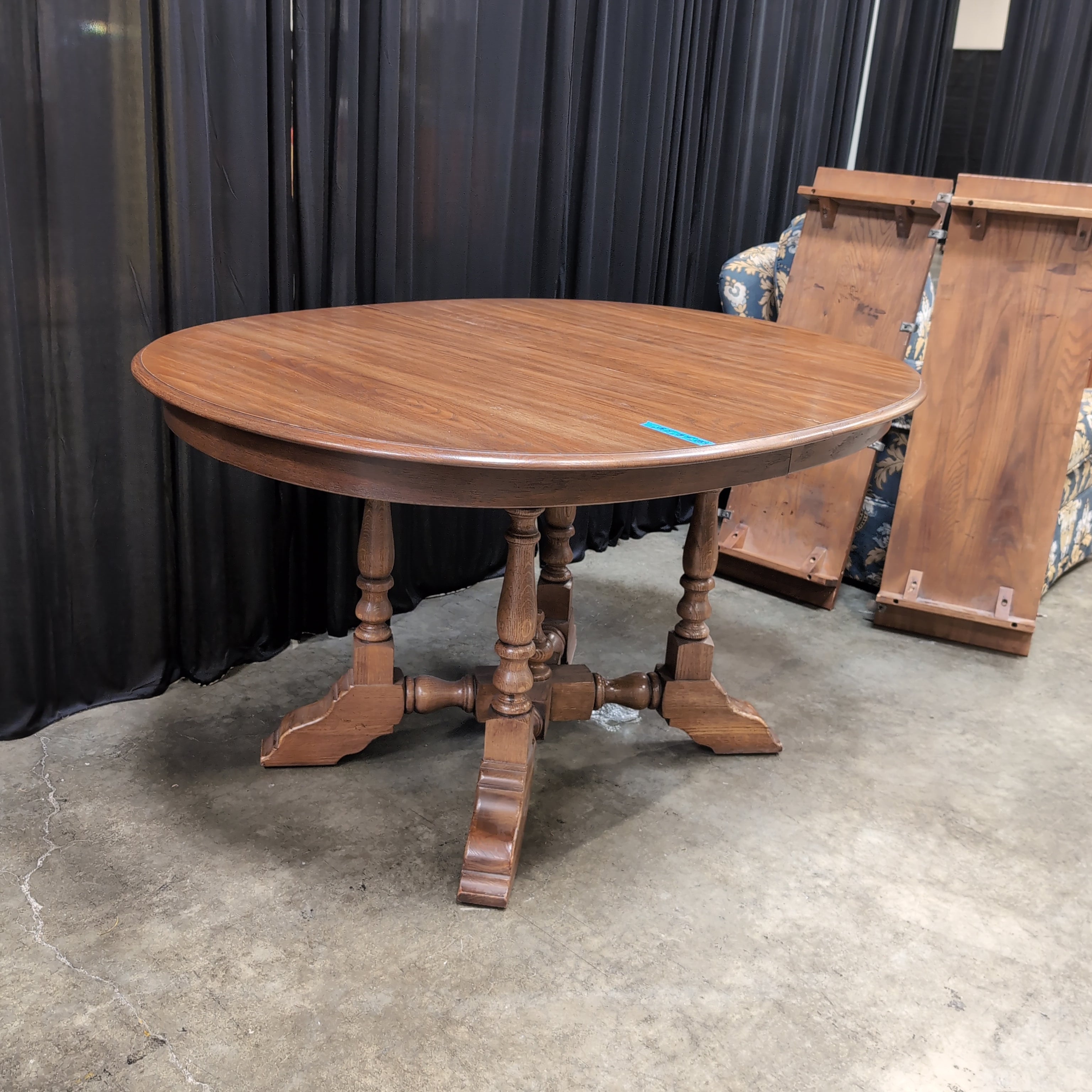 Round Brown Wood Dining Table with Drop Leaves
