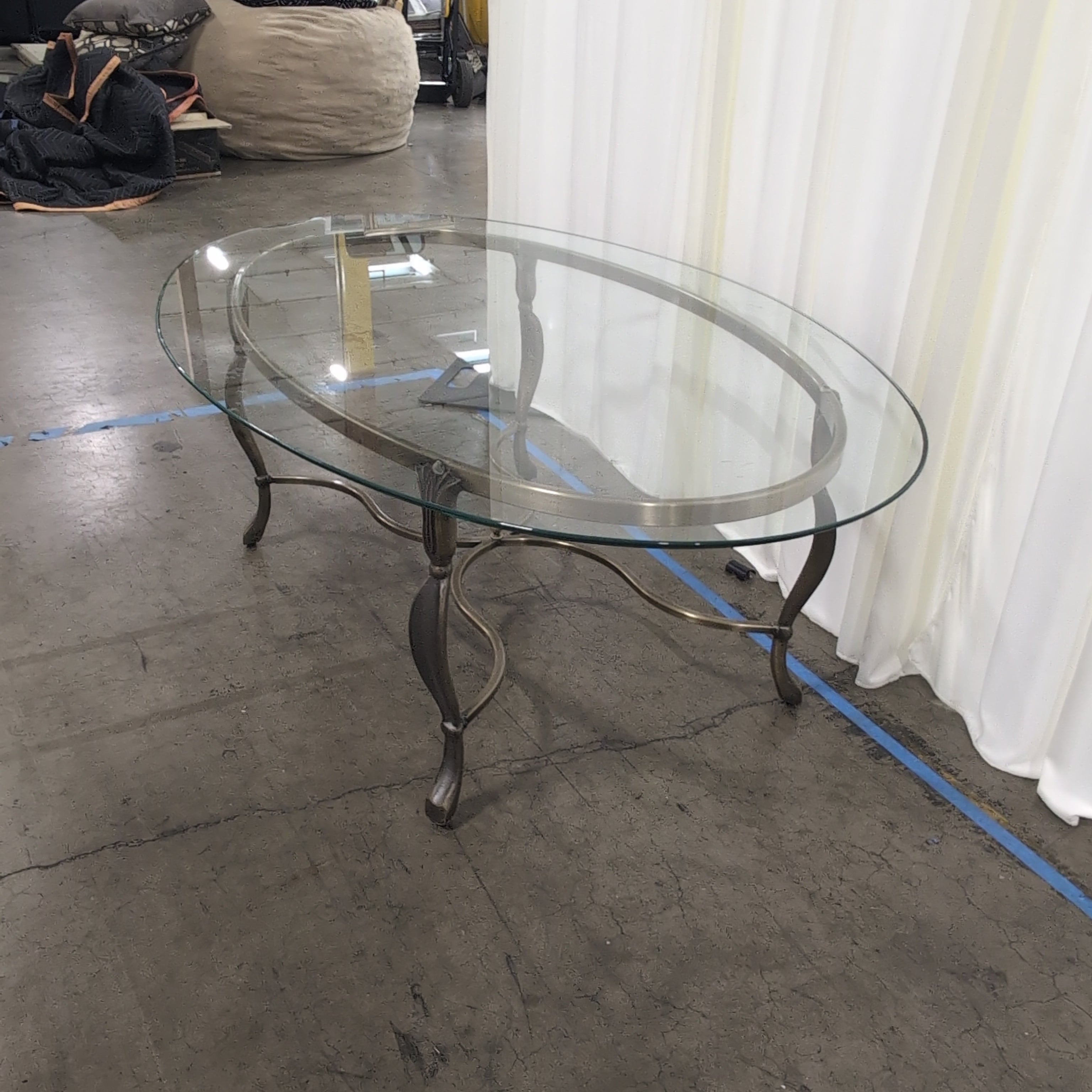 Oval Glass Coffee Table with Ornate Metal Base
