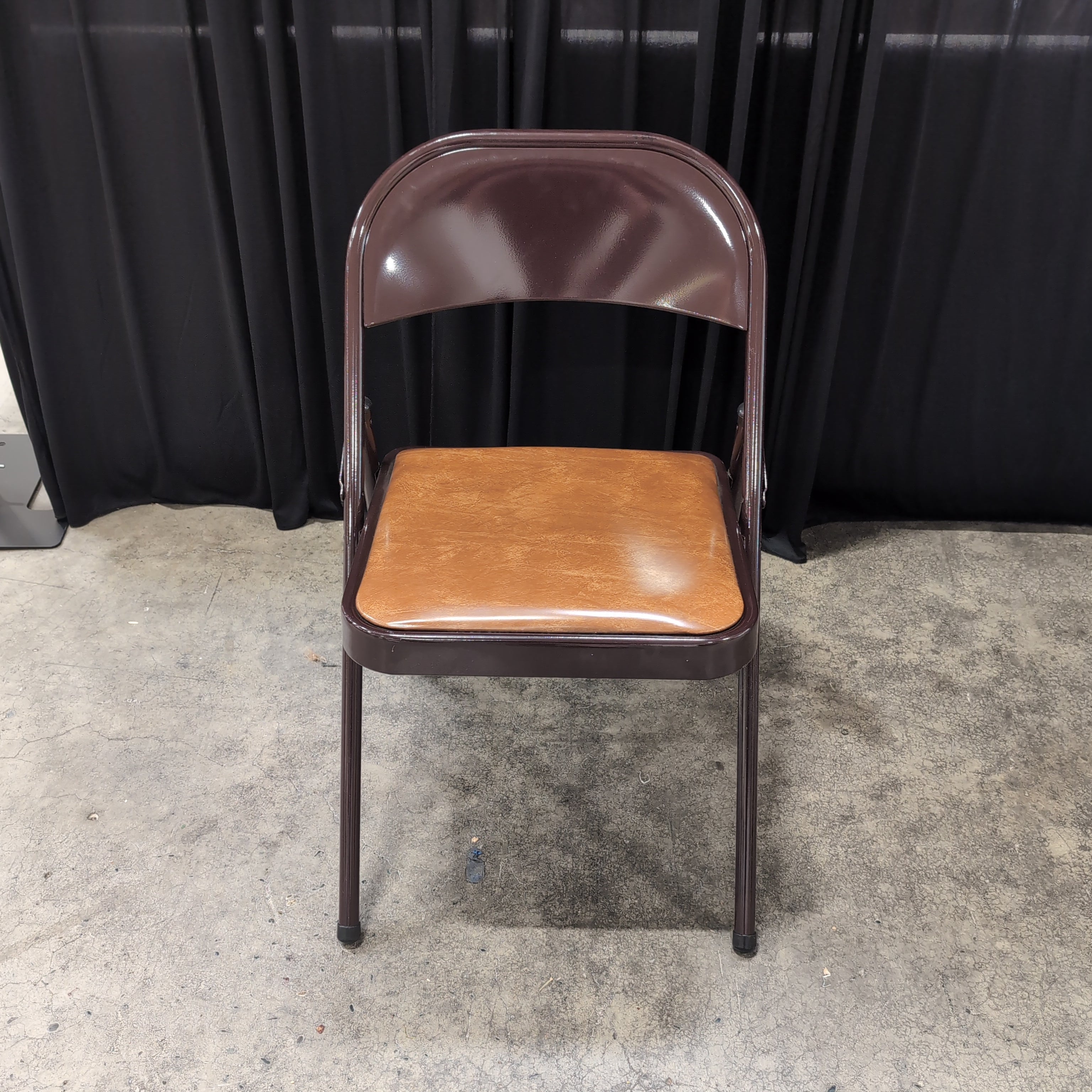 Brown Metal Folding Chair with Tan Upholstered Seat