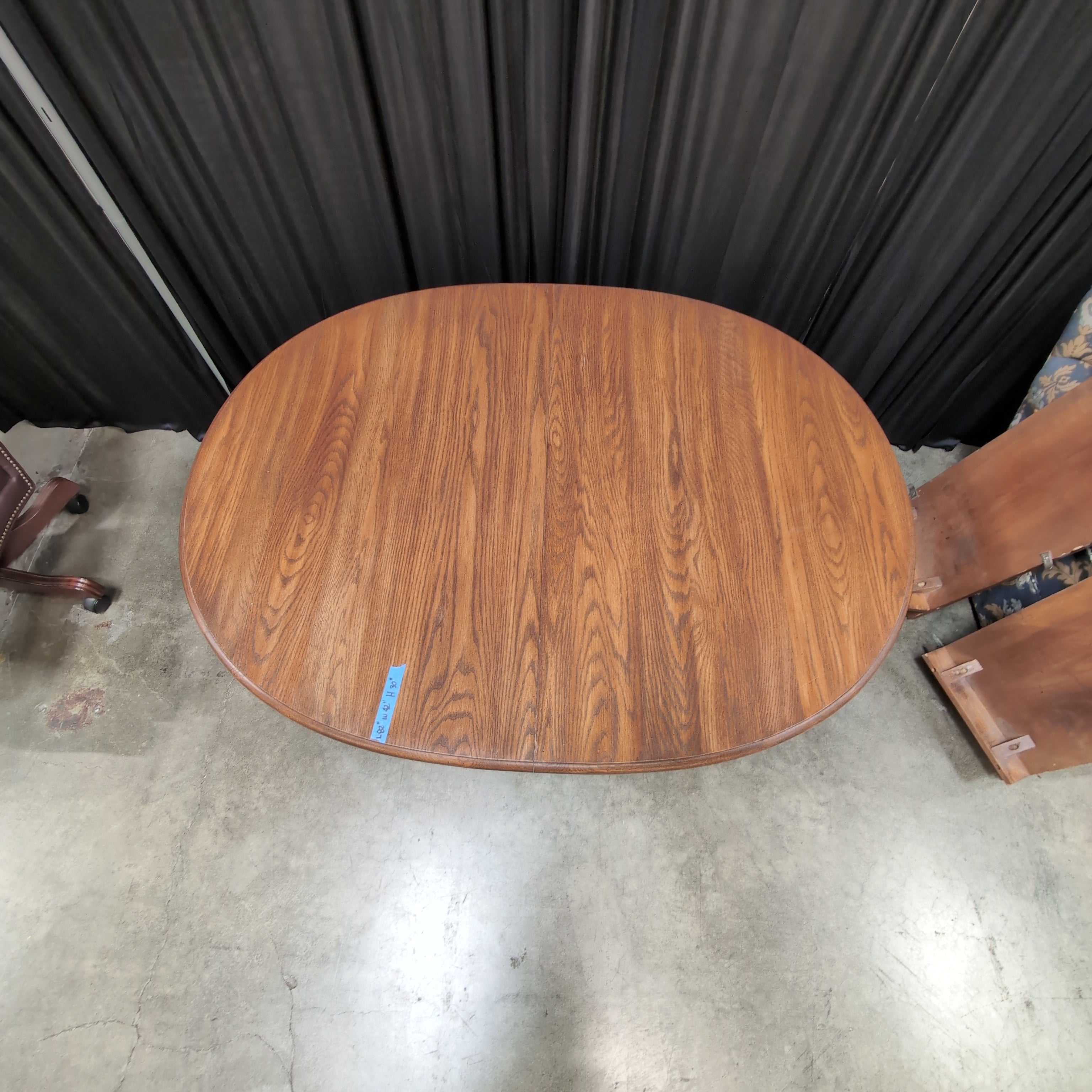 Round Brown Wood Dining Table with Drop Leaves