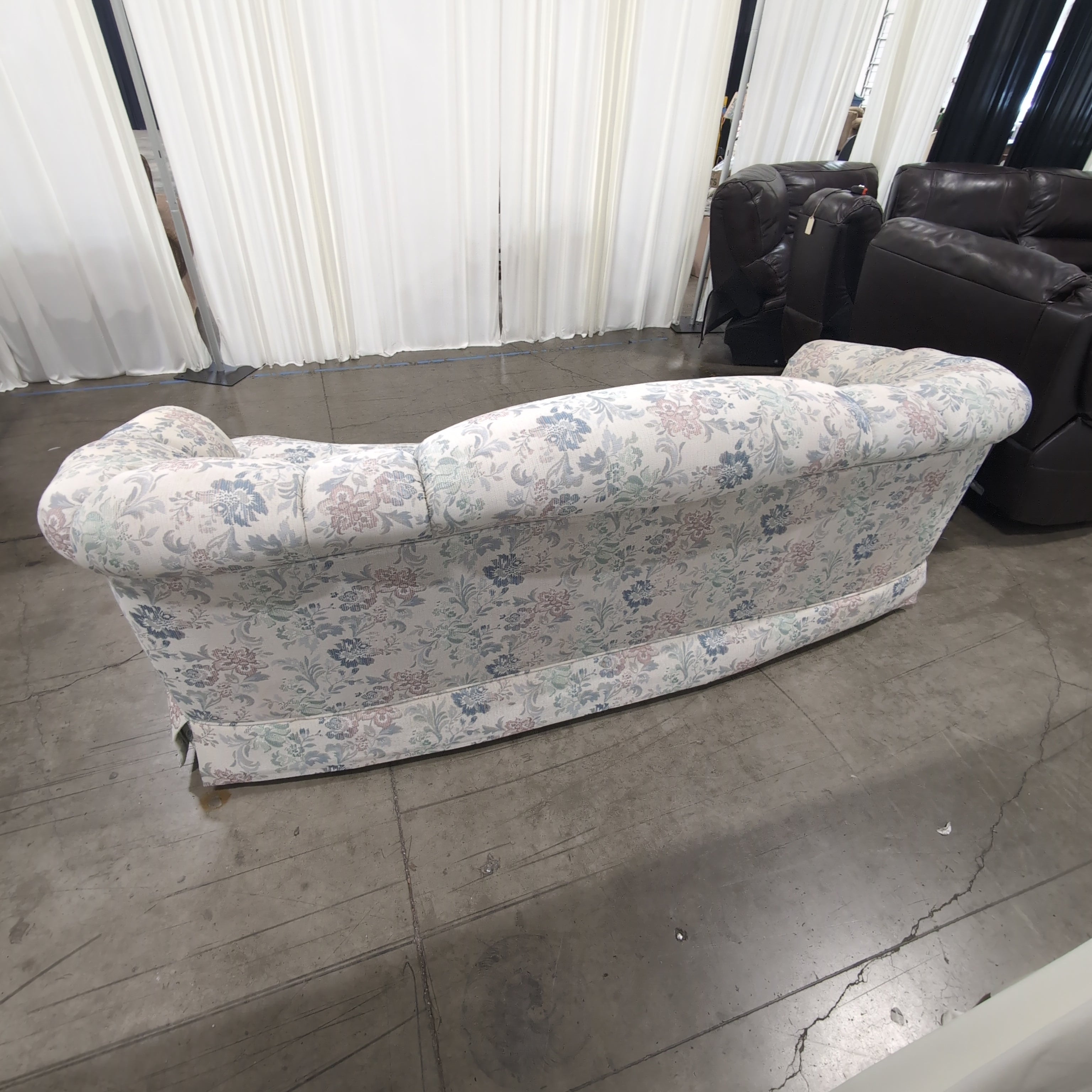 Floral Pattern Skirted Upholstered Couch with Rolled Arms