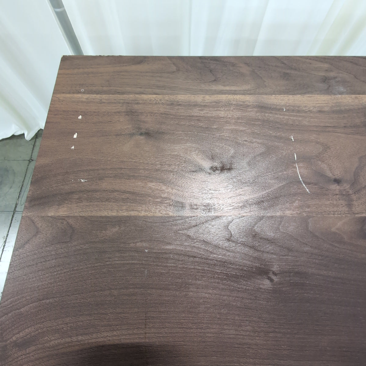 Dark Wood Four-Drawer Dresser with Metal Pulls