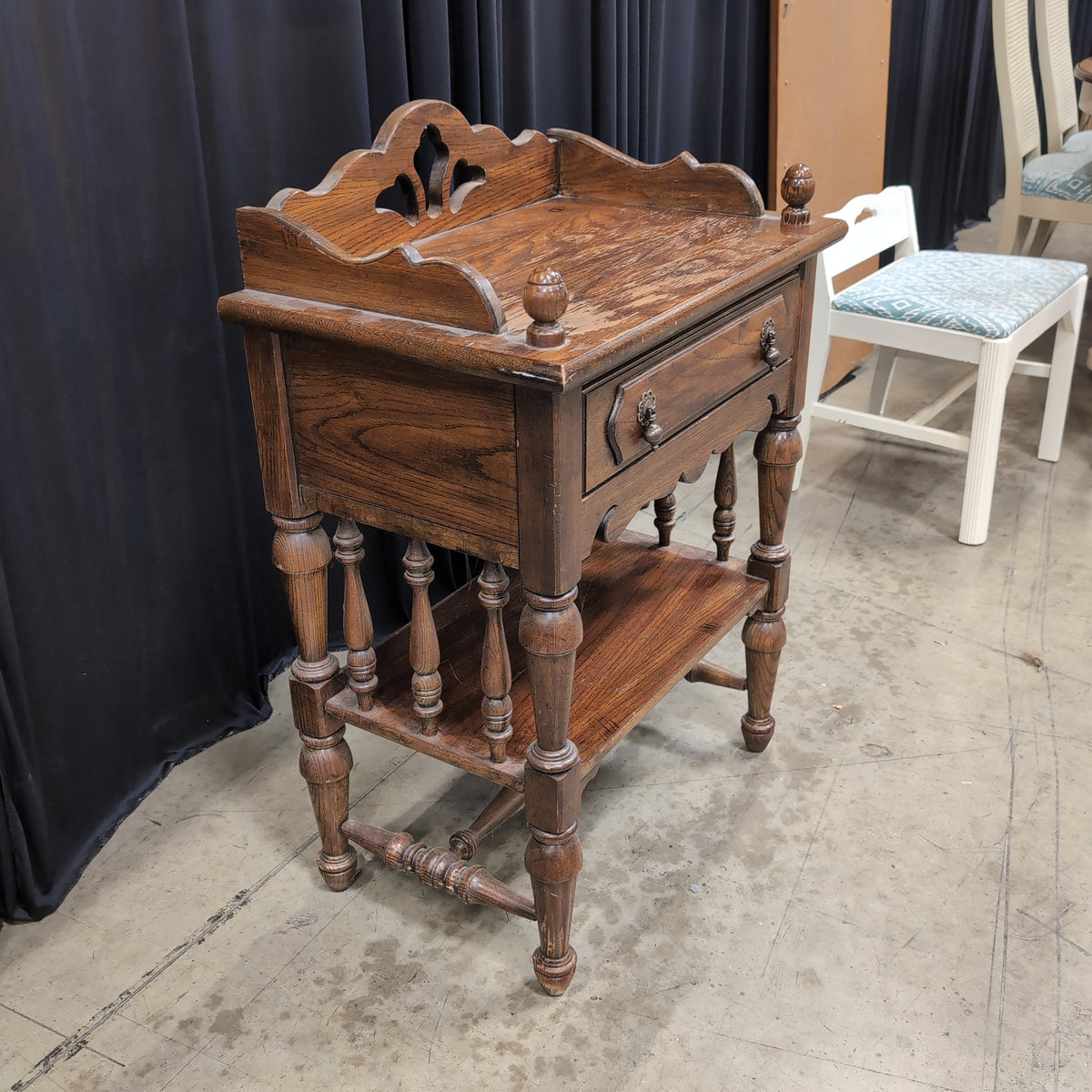 Dark Stained Wood Nightstand with Ornate Hardware
