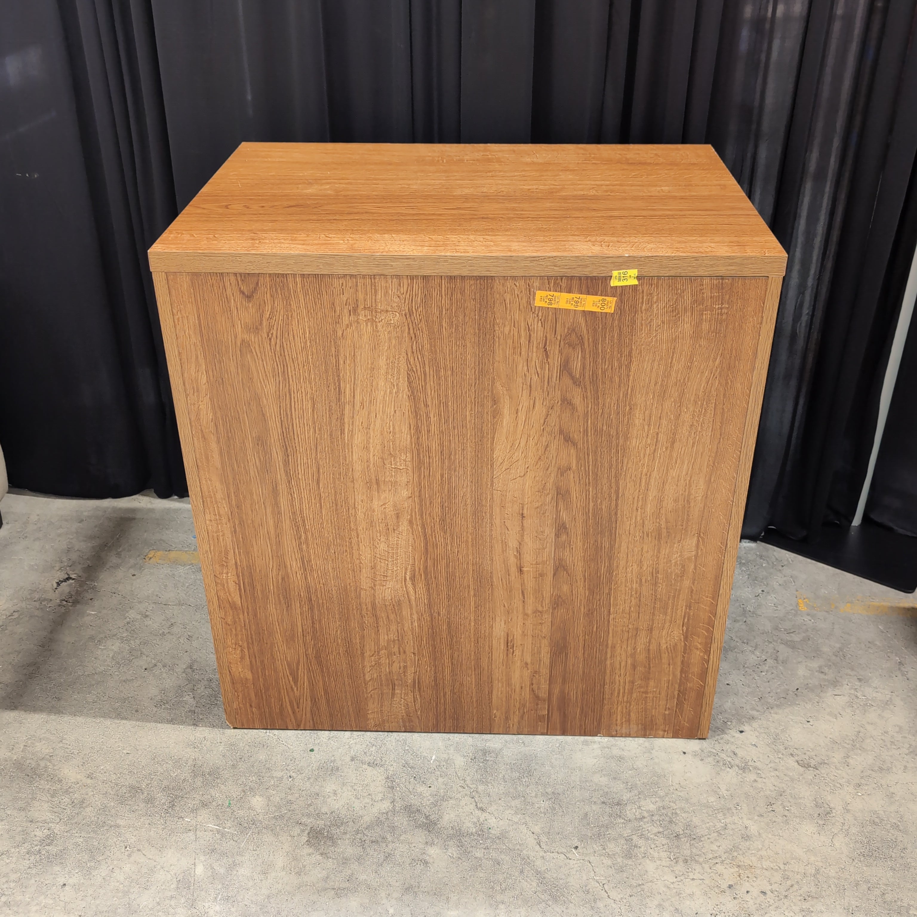 Brown Wood Three-Drawer Dresser with Dark Metal Pulls