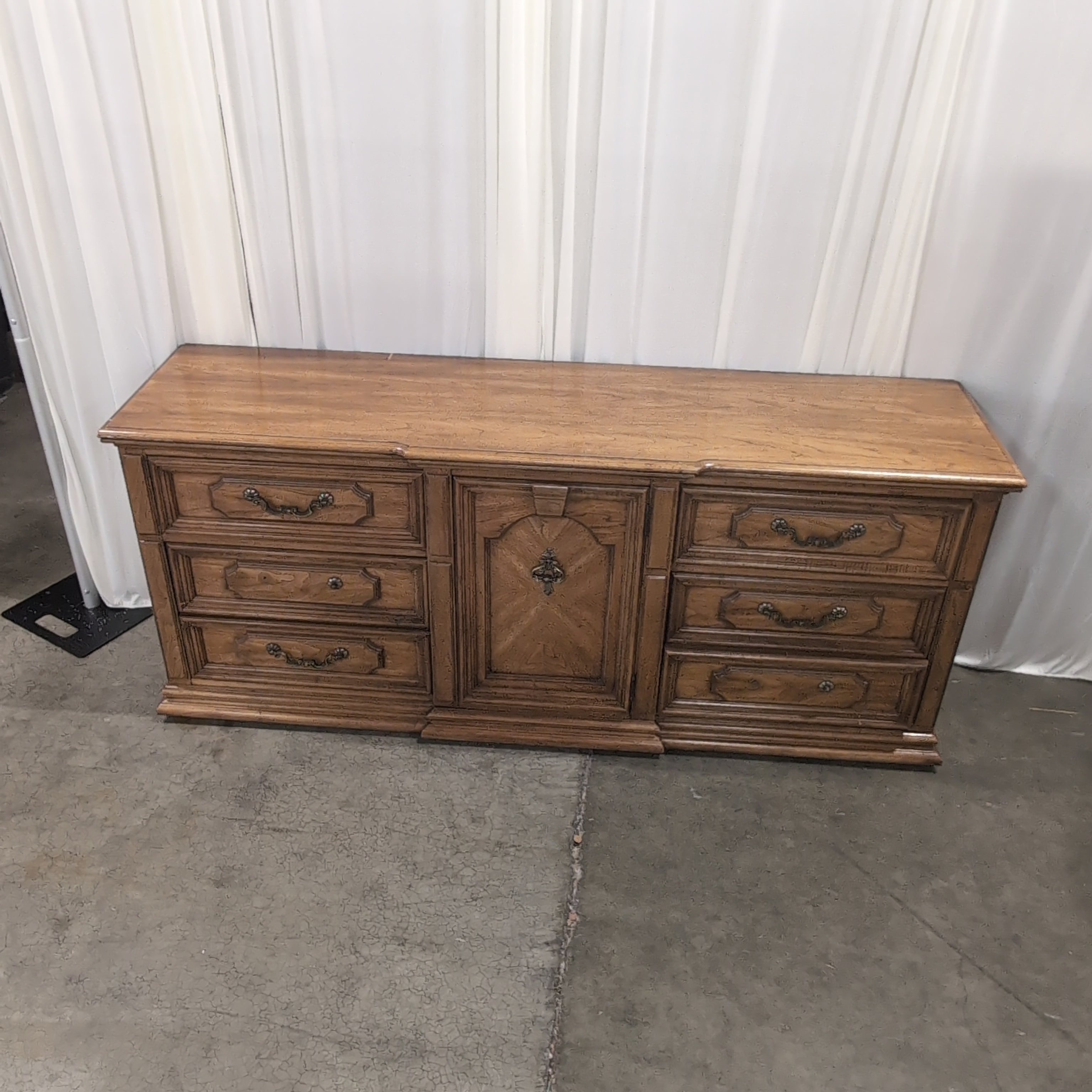 Traditional Brown Wood Dresser with Ornate Hardware