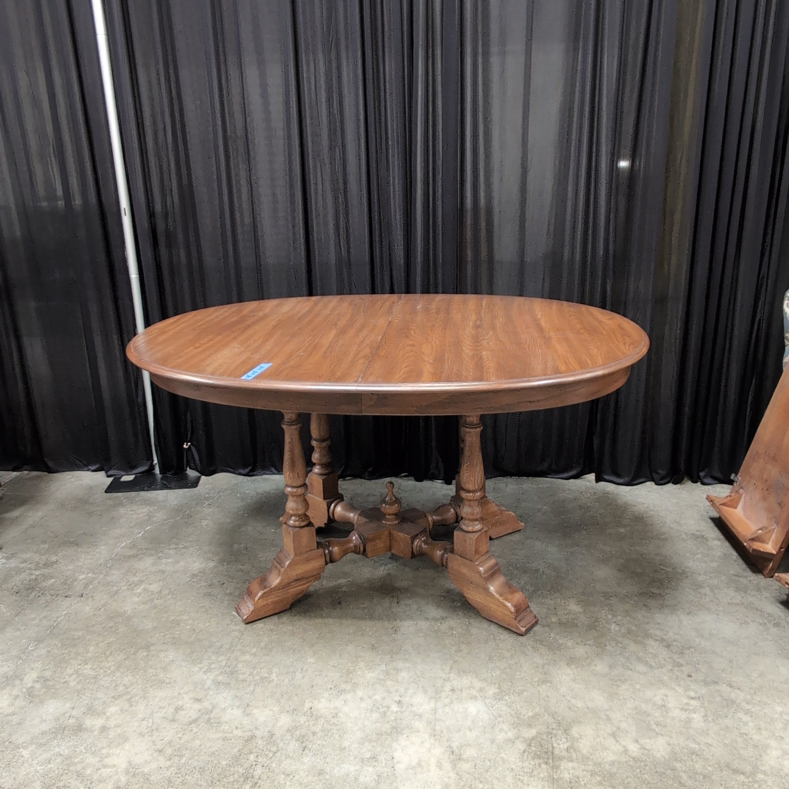 Round Brown Wood Dining Table with Drop Leaves