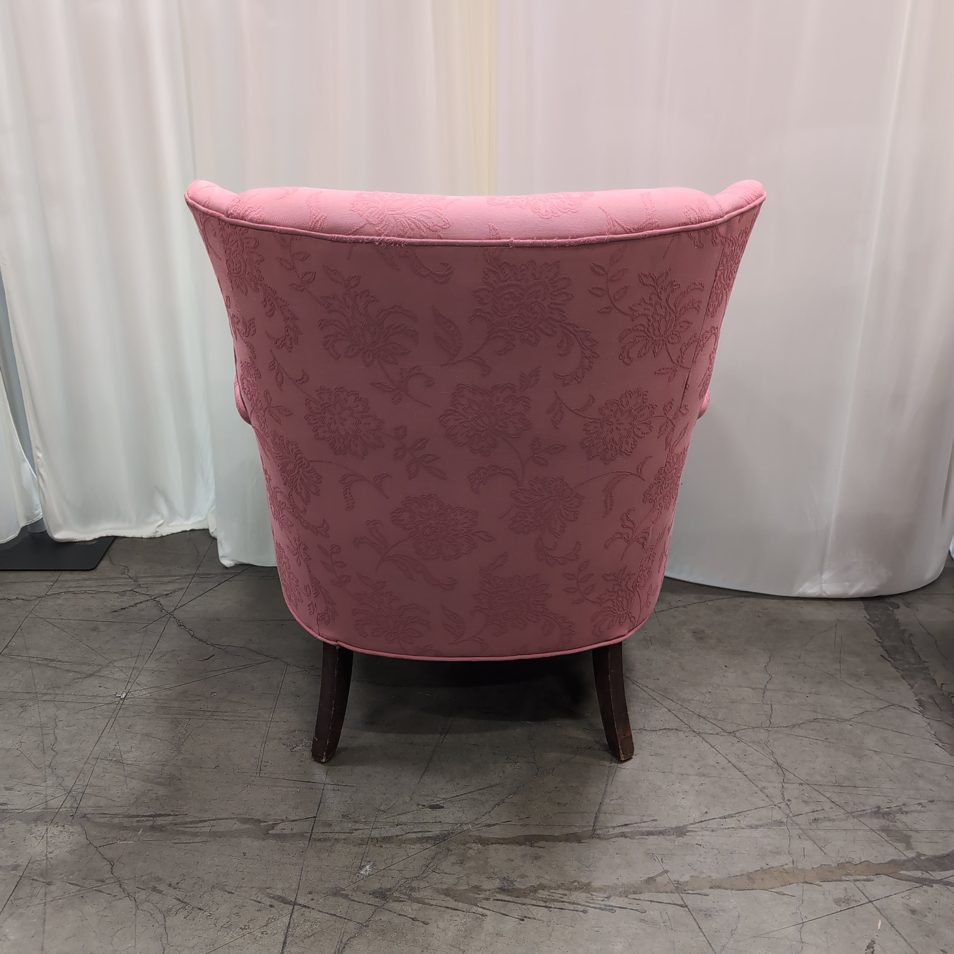 Pink Floral Upholstered Wingback Chair with Carved Wood Arms