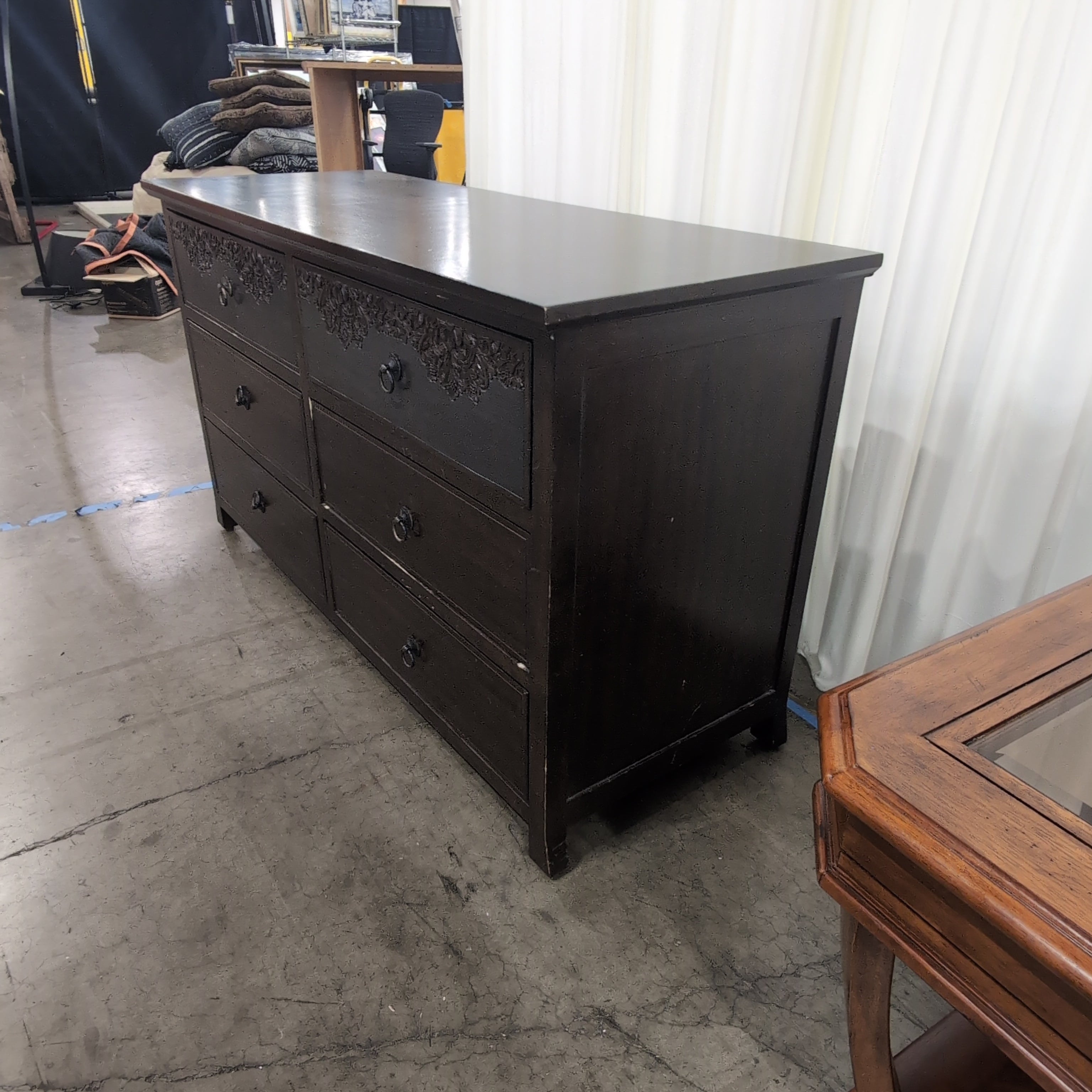 Dark Brown Six-Drawer Dresser with Ornate Carvings