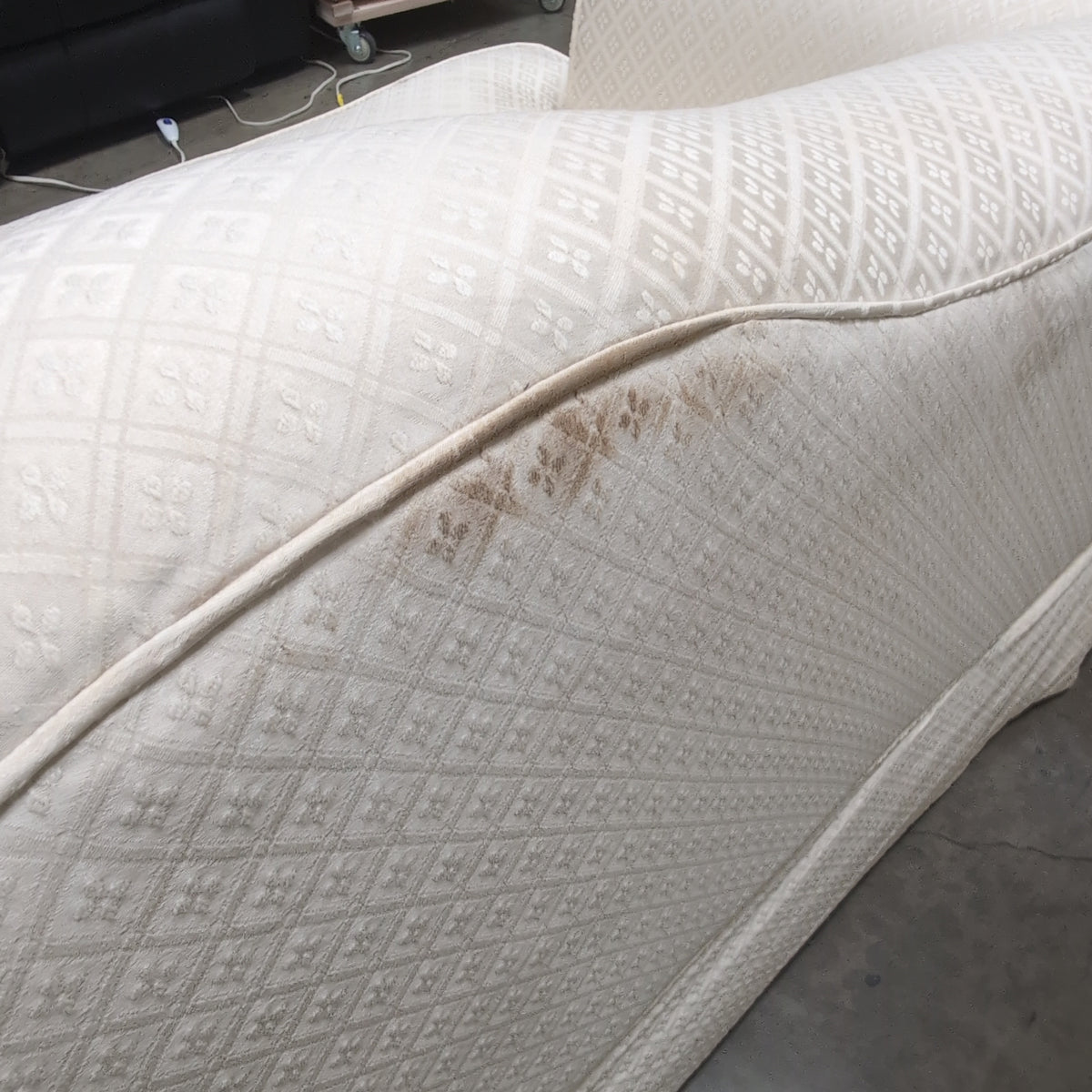 Cream Patterned Fabric Loveseat with Rolled Arms