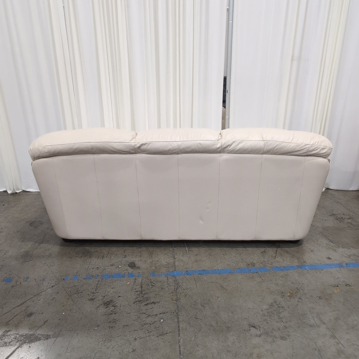 Cream-Colored Three-Seat Padded Couch