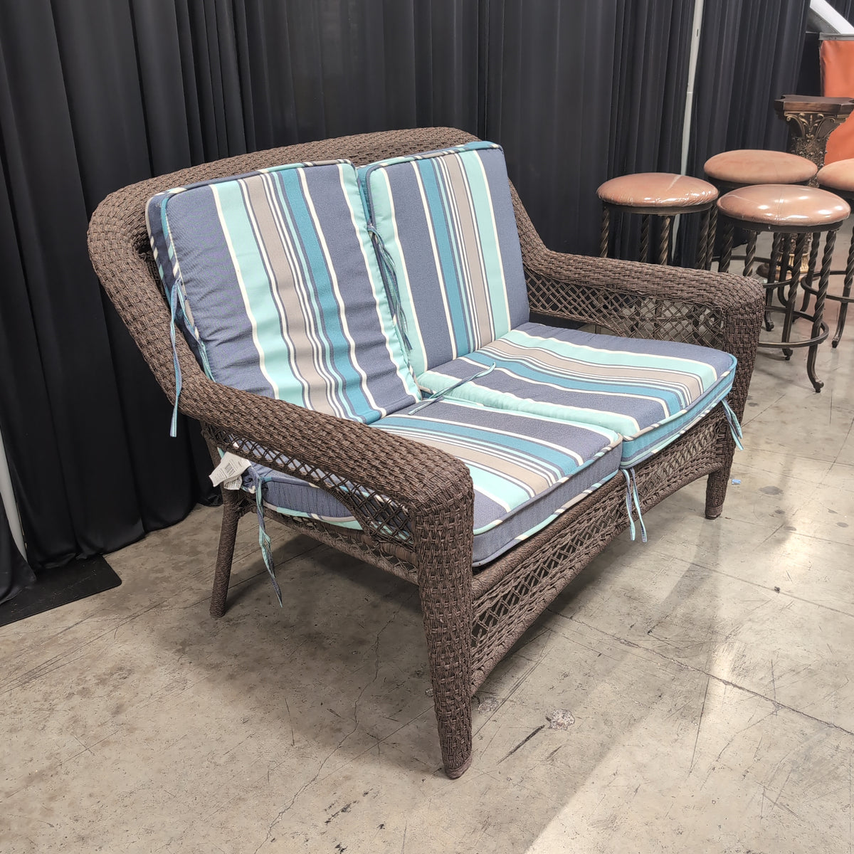 Dark brown wicker loveseat