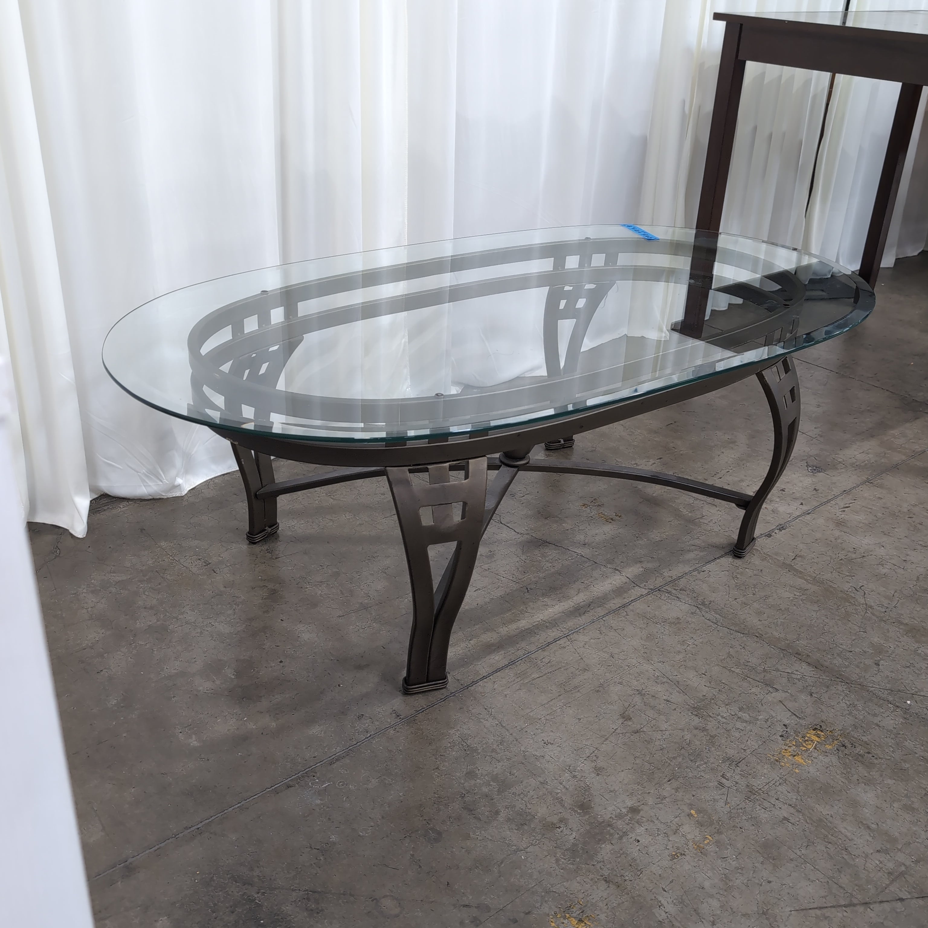Oval Glass Coffee Table with Dark Metal Base