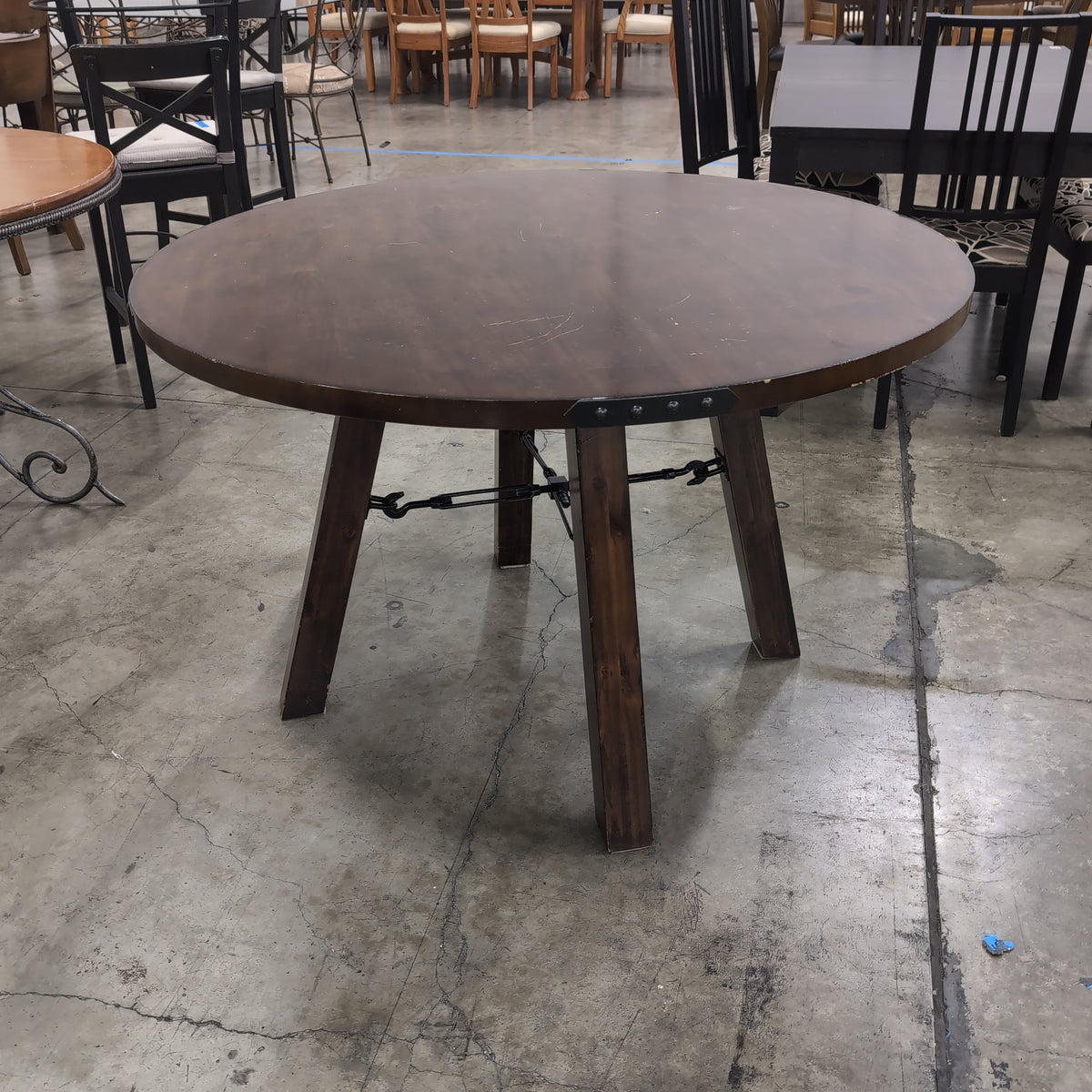 Rustic Dark Wood Round Dining Table with Metal Accents