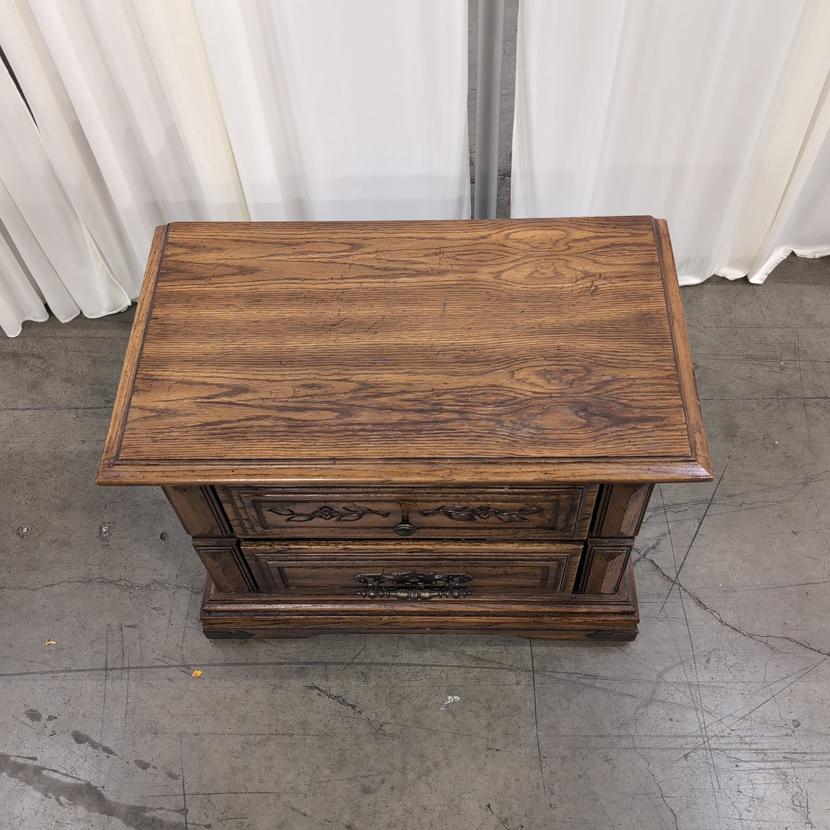 Traditional Dark Wood Two-Drawer Nightstand with Ornate Hardware