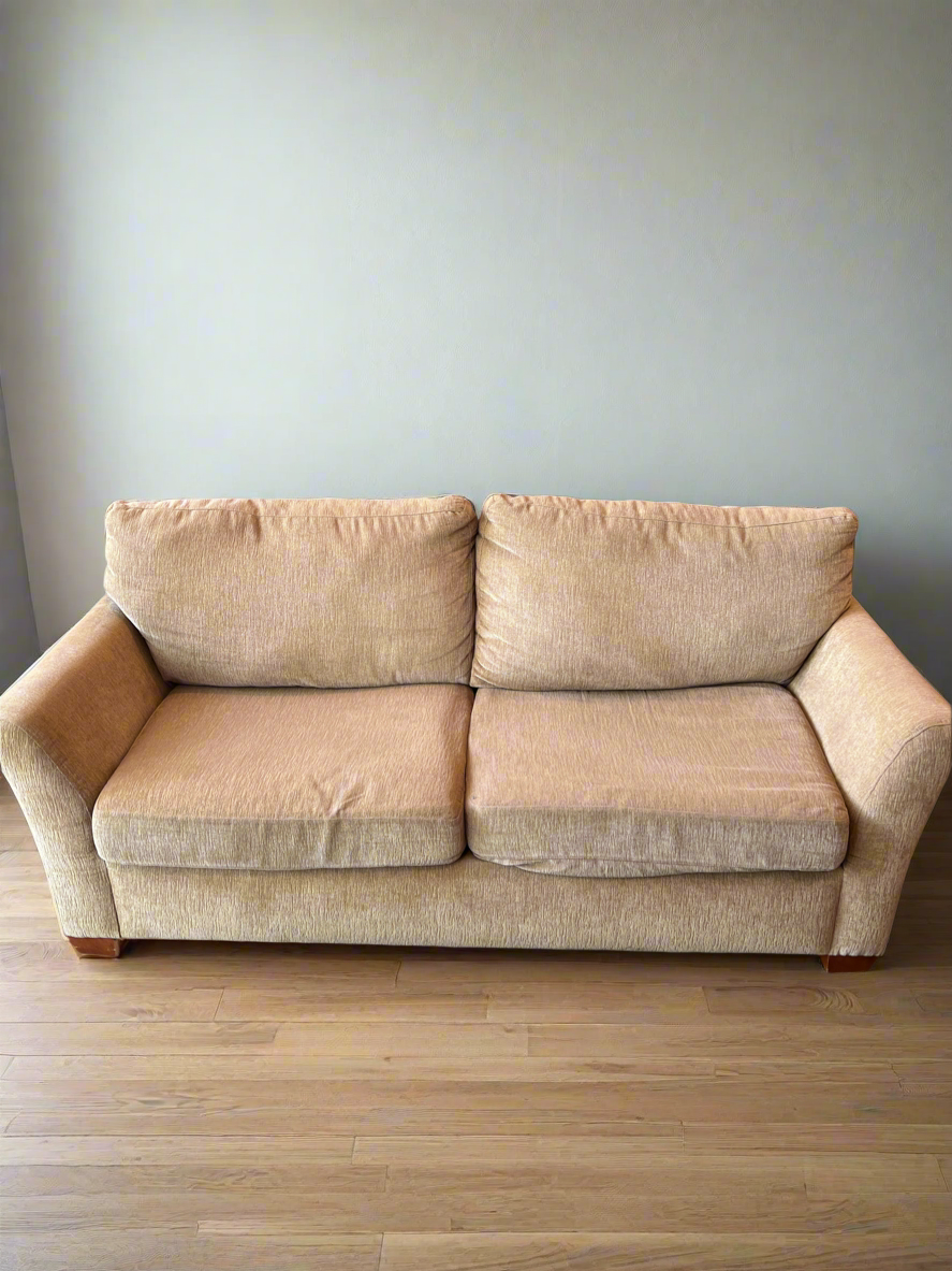 Tan Two Seat Sofa With Two Cushions - Rip in Upper Part of Couch - Price Reflects Damage