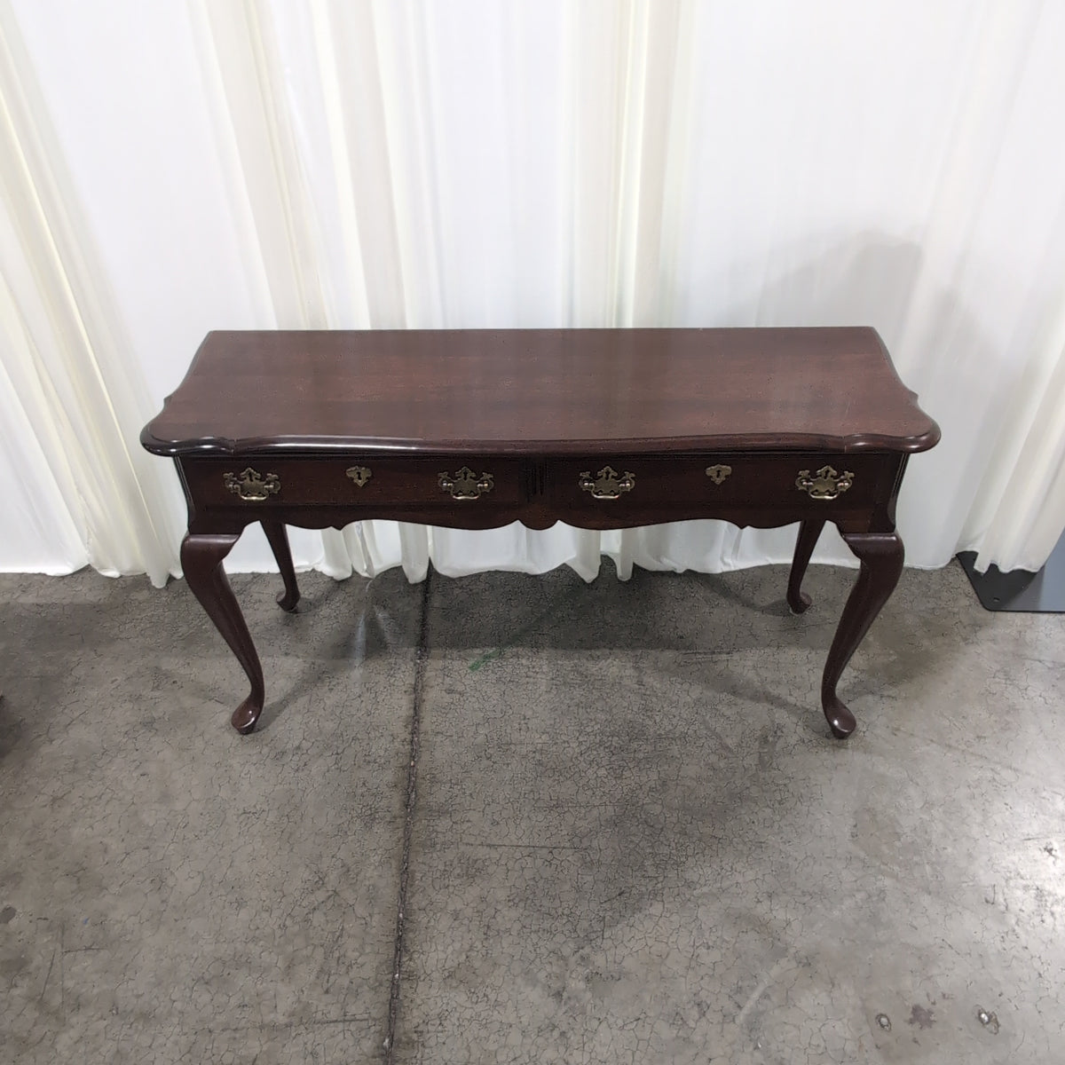Traditional Dark Wood Console Table with Ornate Brass Hardware
