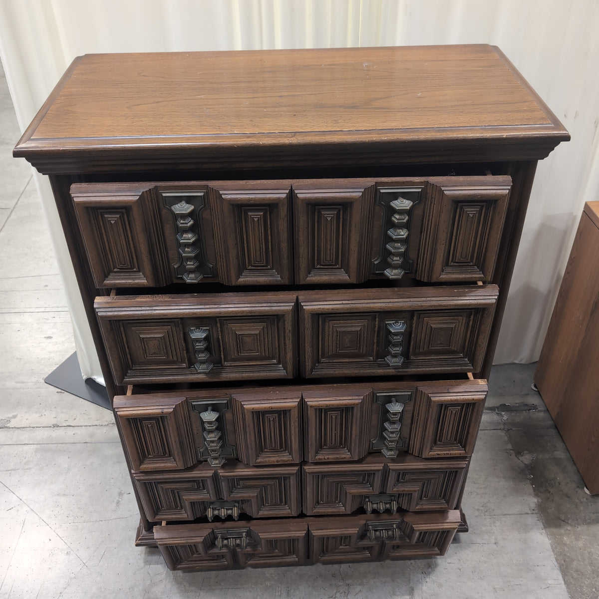 Dark Wood Carved Geometric Dresser with Ornate Hardware
